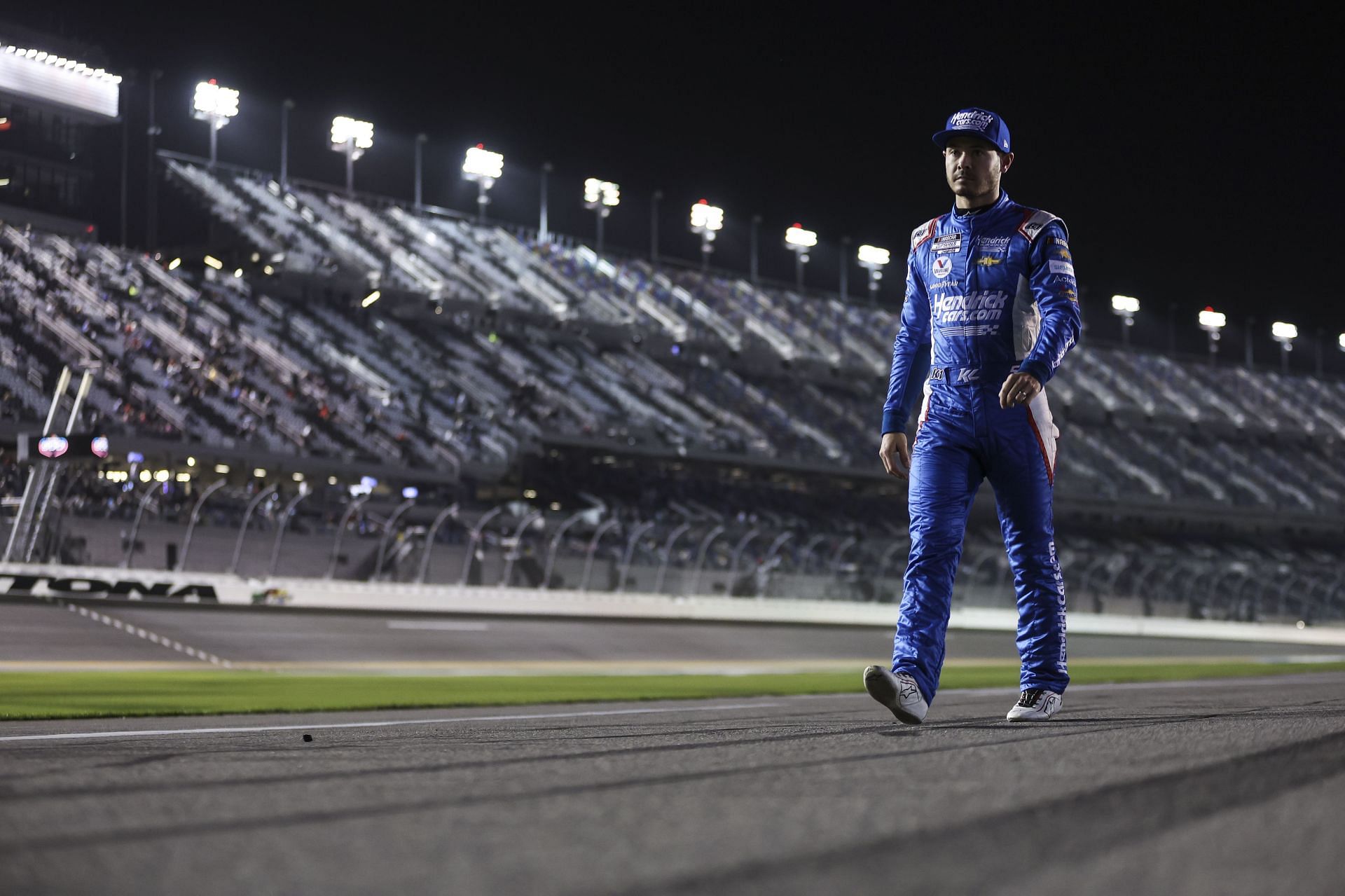 Kyle Larson walking on the tarmac at the 64th Annual Daytona 500