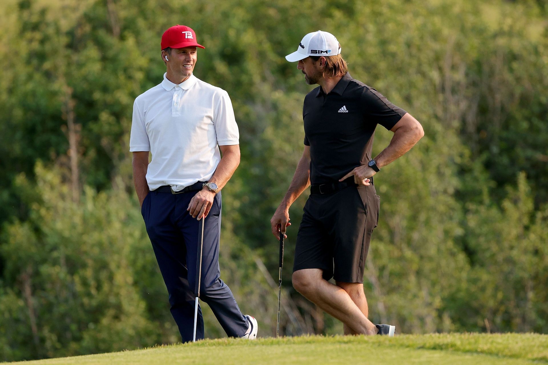Aaron Rodgers and Tom Brady during Capital One&#039;s The Match The superstar quarterbacks at a round of golf