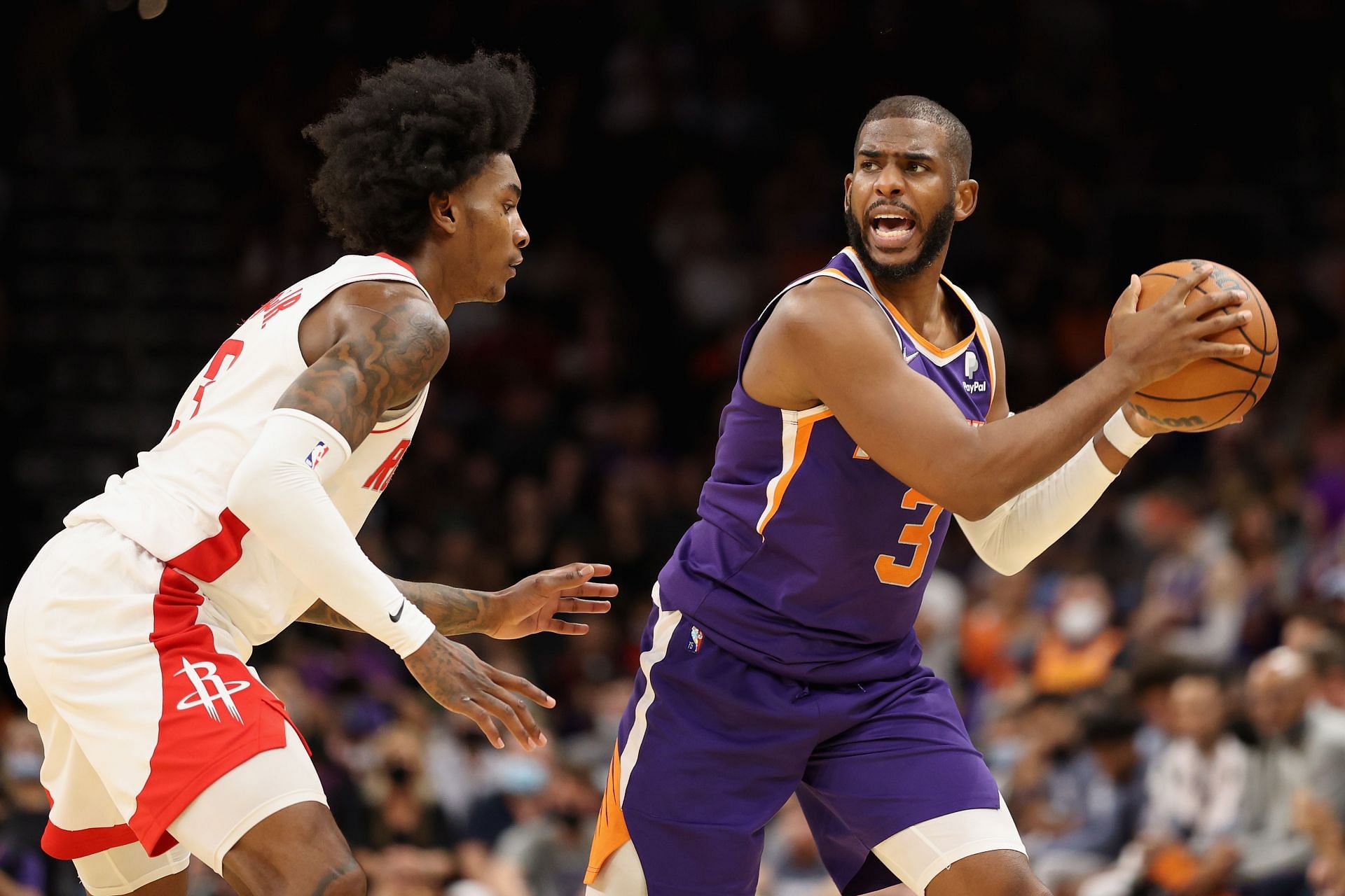 Chris Paul of the Phoenix Suns against Kevin Porter Jr. of the Houston Rockets