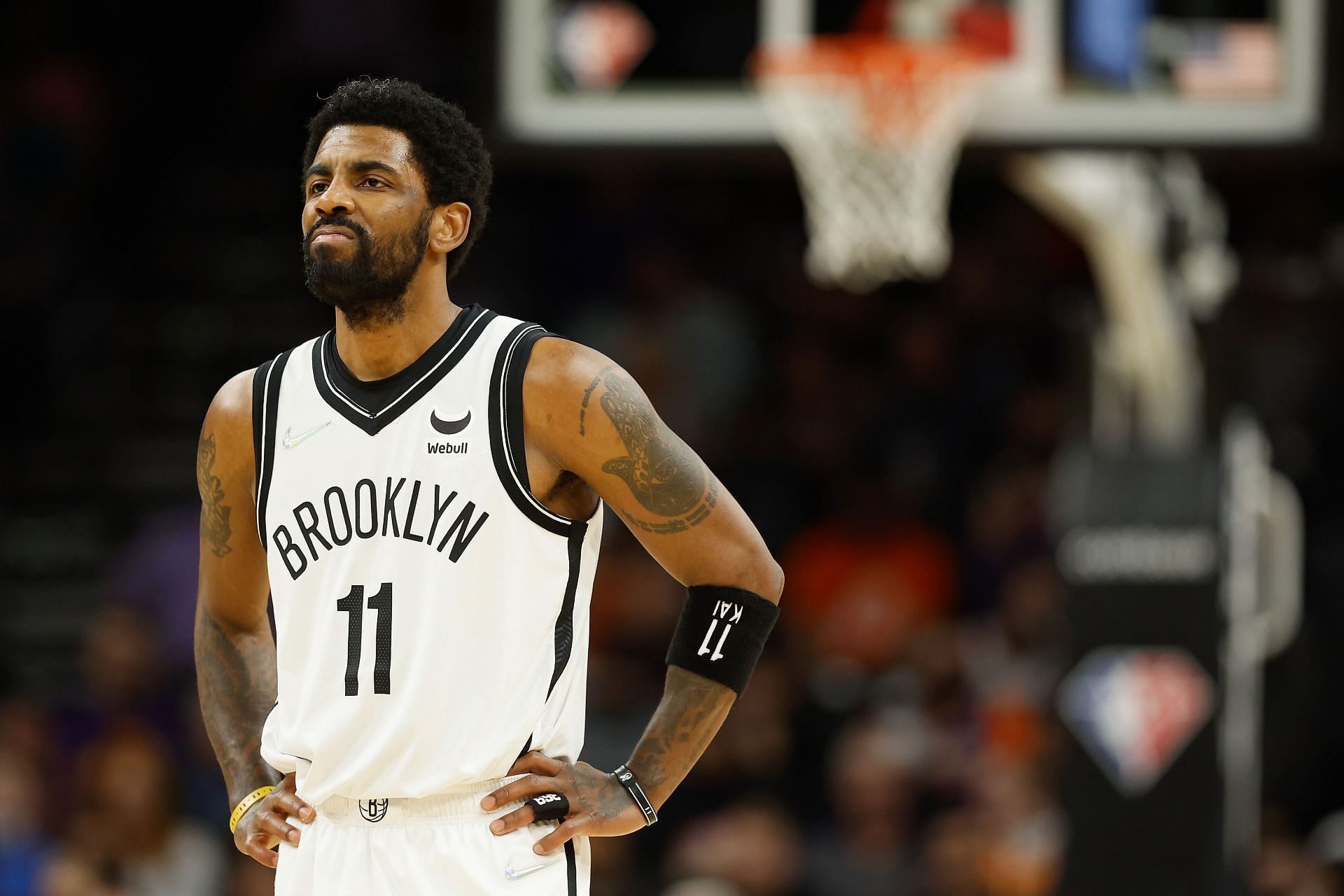Kyrie Irving looks on at a Brooklyn Nets game