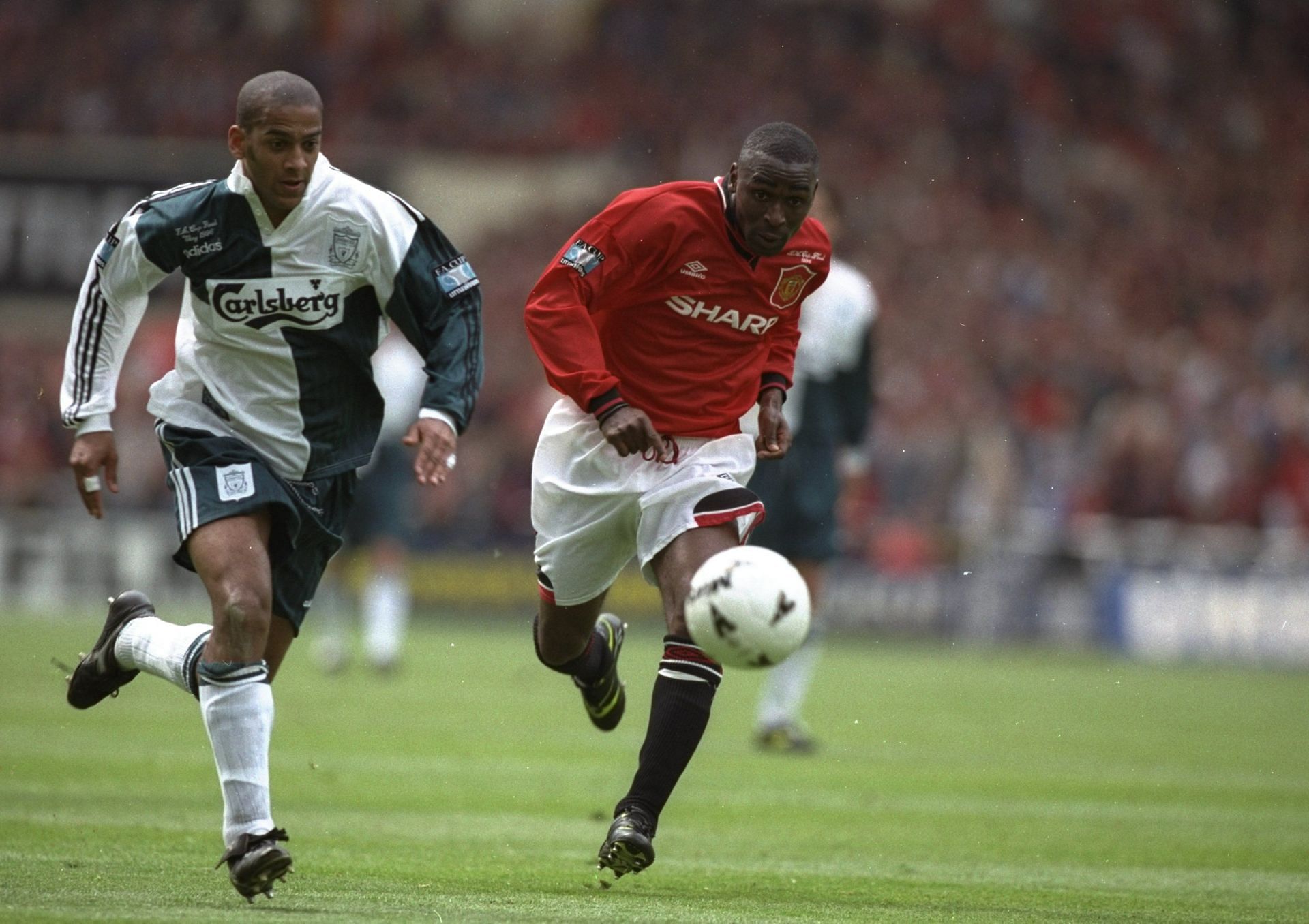 Andy Cole of Manchester United and Phil Babb of Liverpool