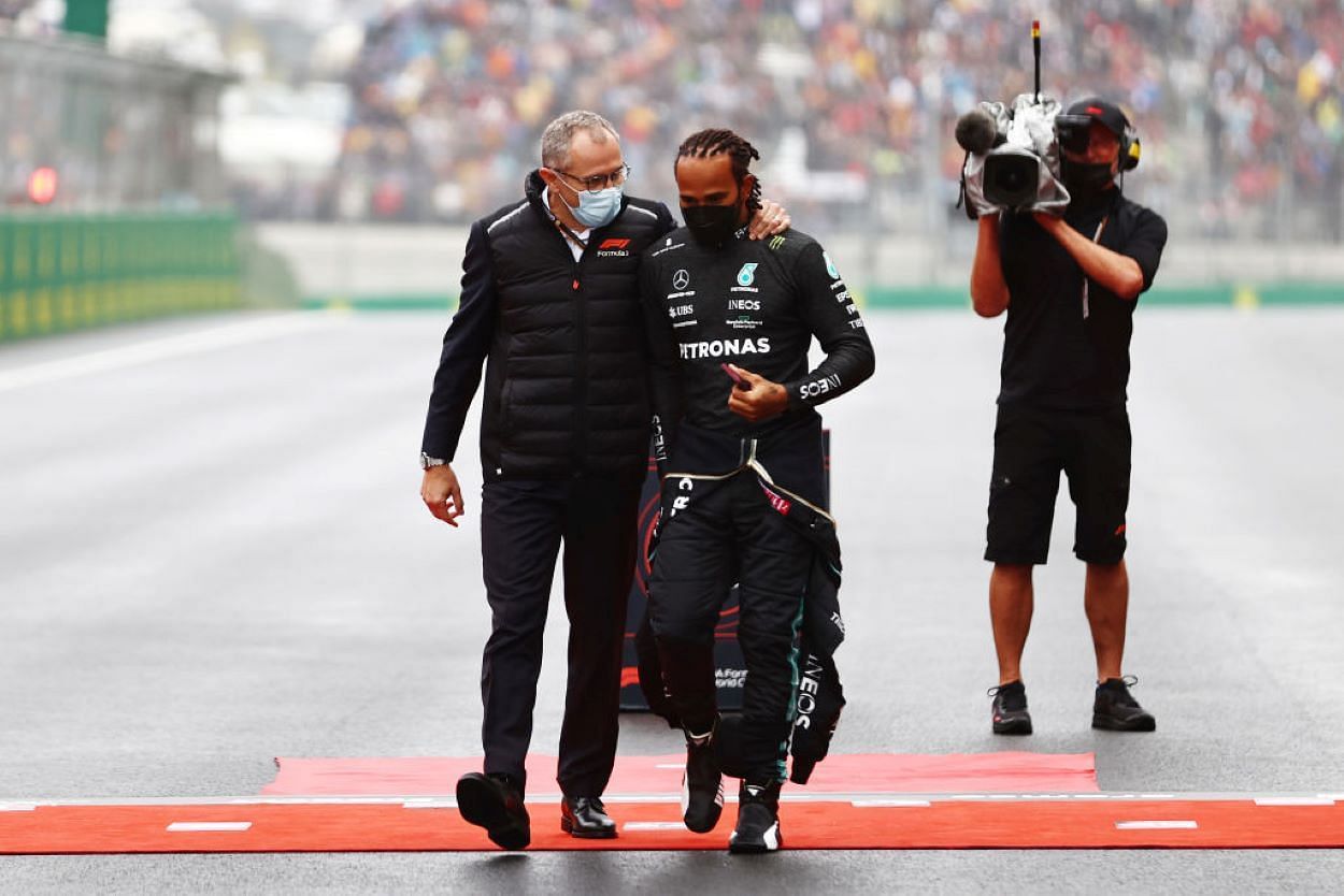 Lewis Hamilton and Formula One chief executive Stefano Domenicali (left) at the Turkish Grand Prix in Istanbul (Photograph: Mark Thompson/Getty Images)