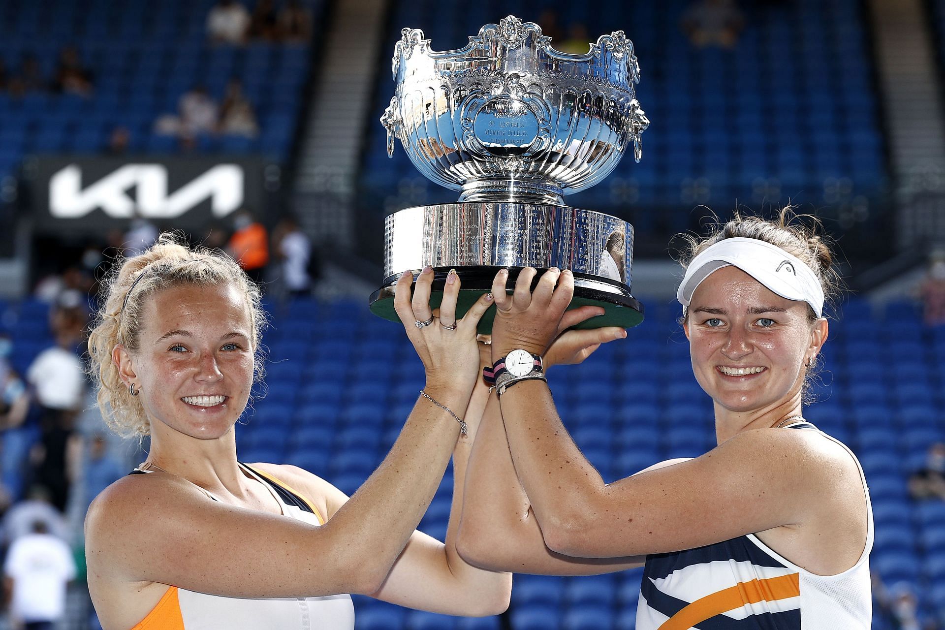 Katerina Siniakova (L) and Barbora Krejcikova pose with the women&#039;s doubles trophy at 2022 Australian Open.