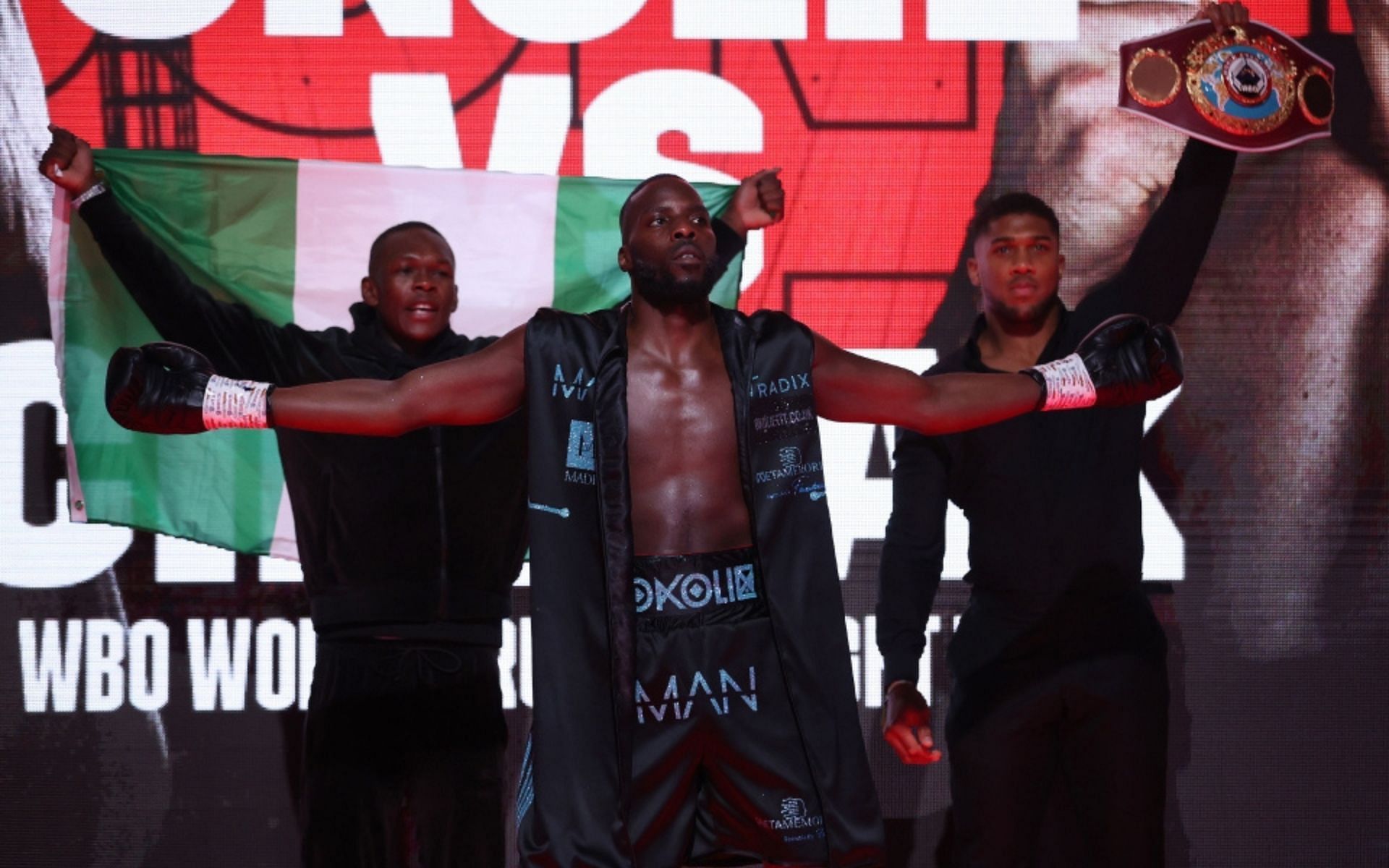 Lawrence Okolie walks out with Israel Adesanya and Anthony Joshua