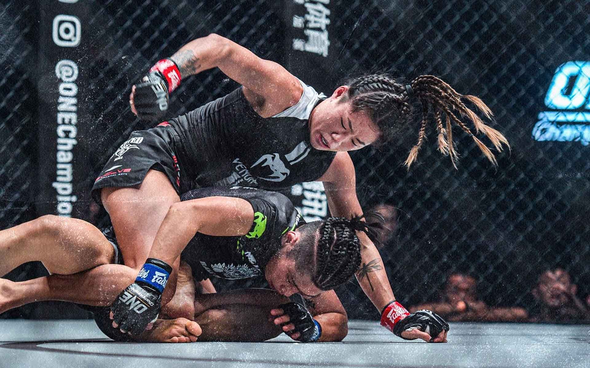 Angela Lee pounds on Xiong Jing Nan from the back [Photo: ONE Championship]