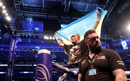 Oleksandr Usyk (center) visited Stamford Bridge ahead of his rematch with Anthony Joshua.