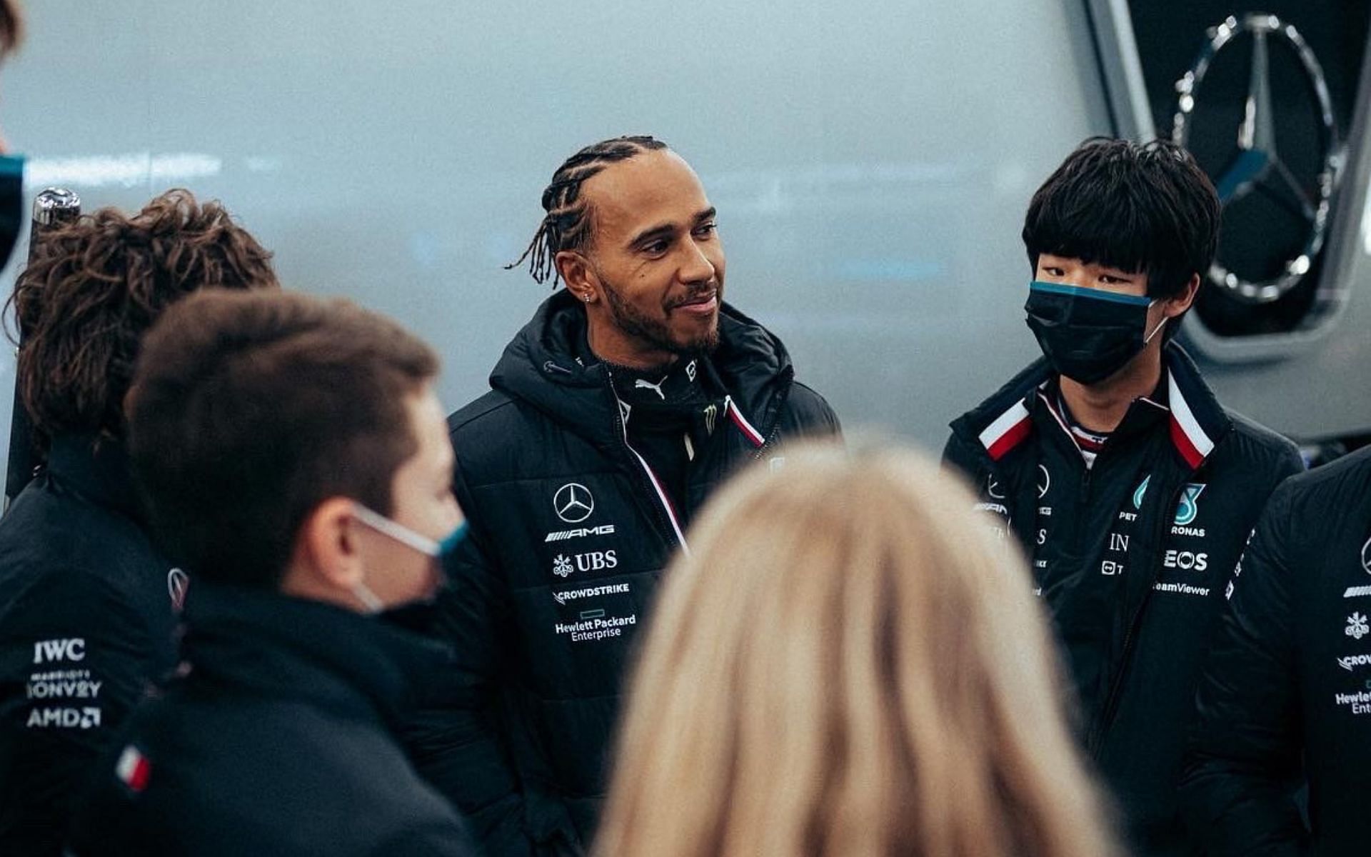 Lewis Hamilton interacts with his team members at Mercedes factory in Brackley. Image Courtesy: Twitter/@MercedesAMGF1