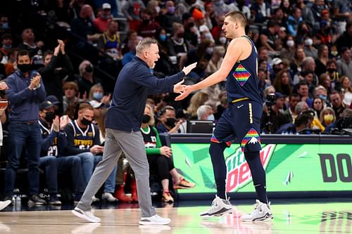 Head coach Michael Malone and Nikola Jokic