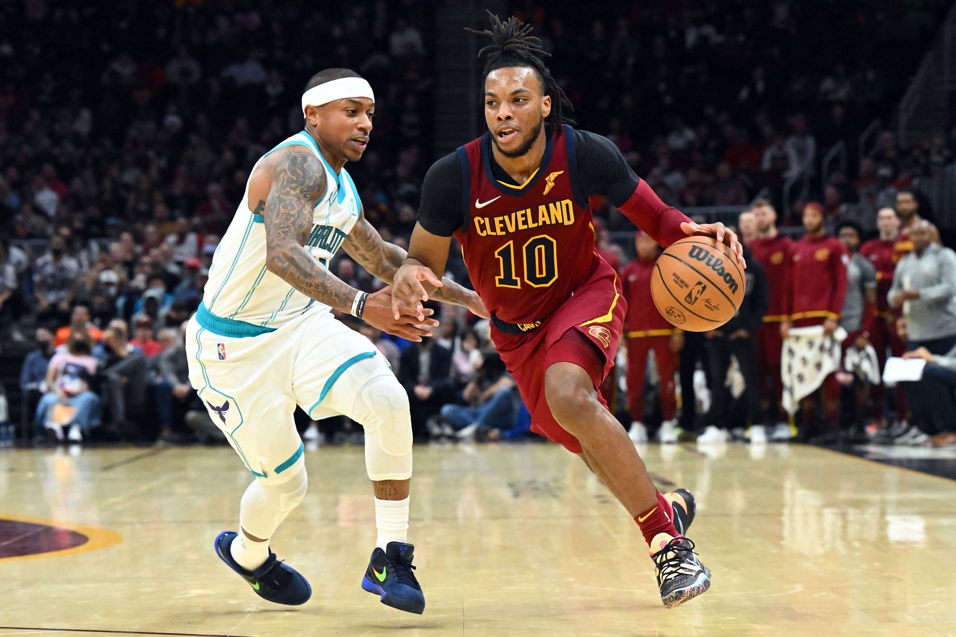 Darius Garland drives past Isaiah Thomas.