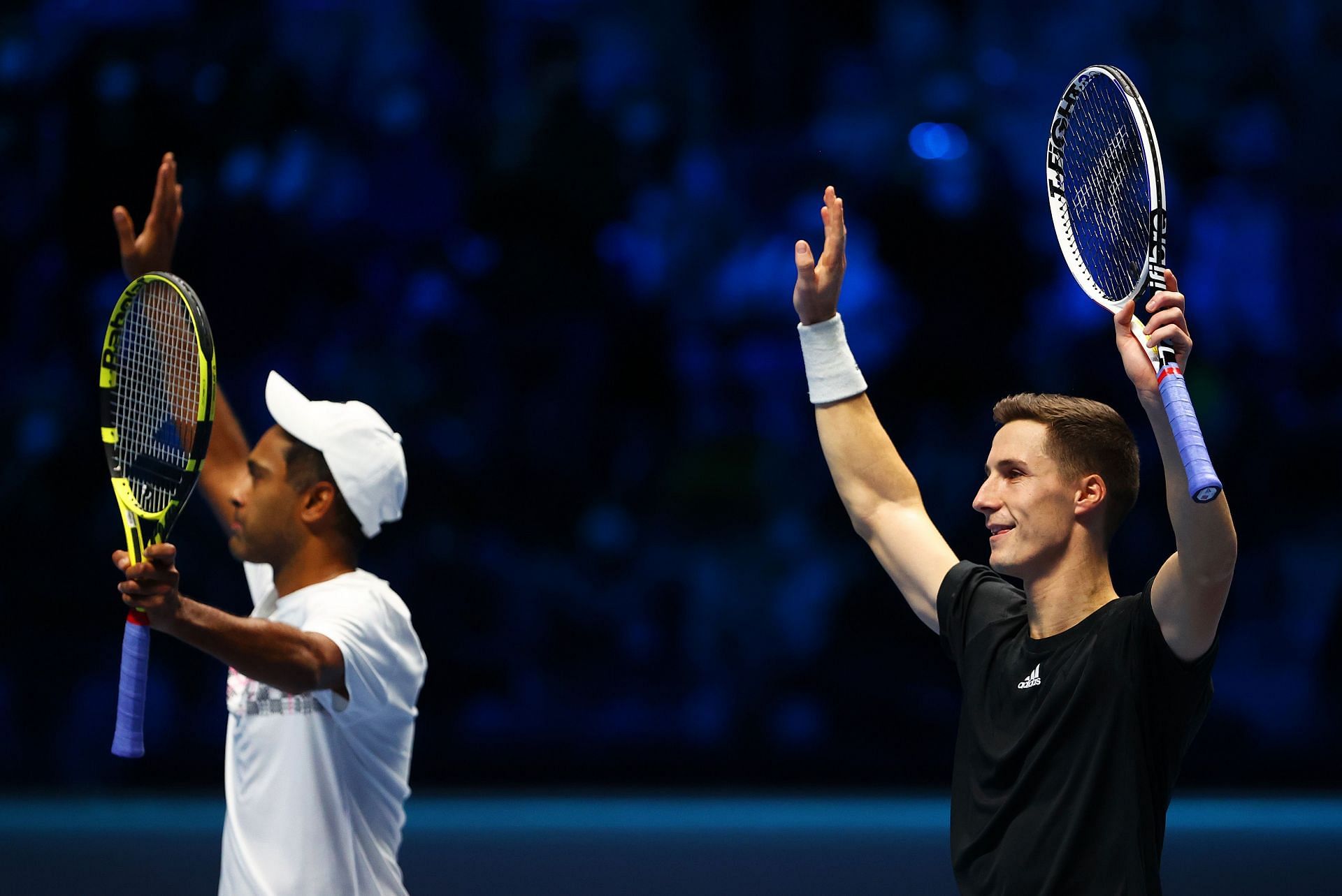 Rajeev Ram (L) acknowledges the crowd after a match at 2021 ATP Finals