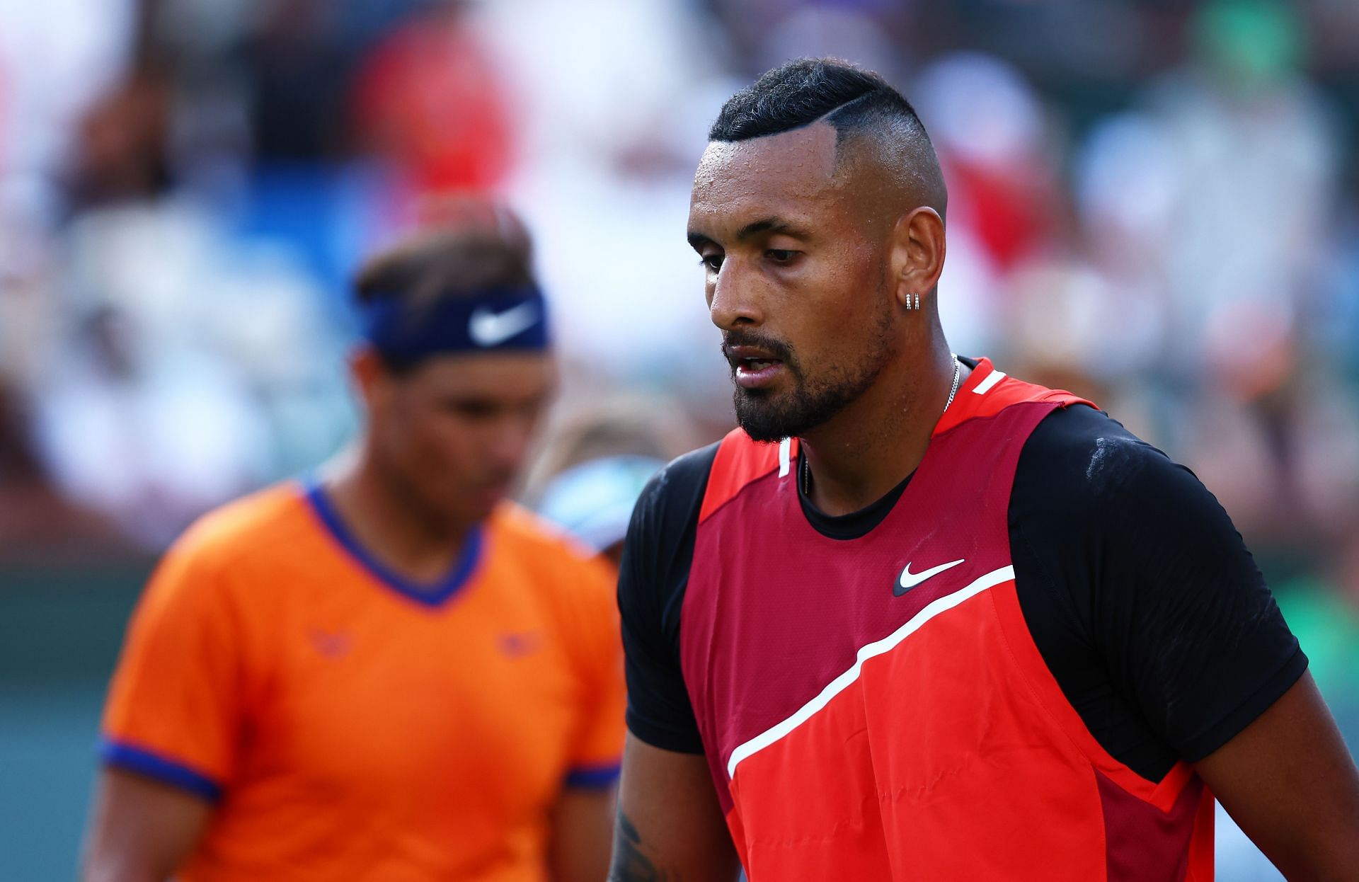 Nick Kyrgios during his match against Rafael Nadal [left]