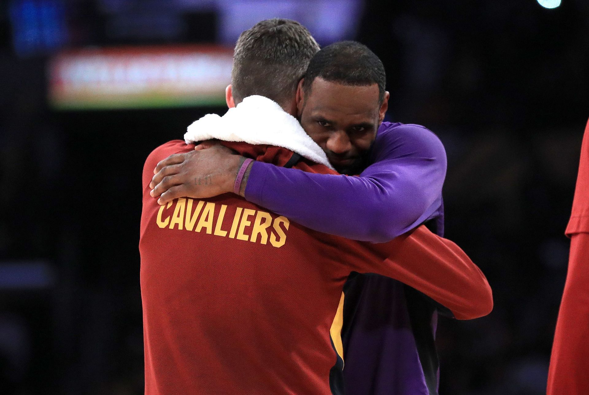 Kevin Love of the Cleveland Cavaliers hugs LeBron James of the Los Angeles Lakers.