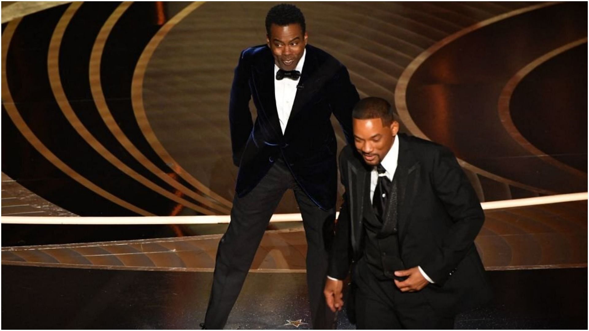 Will Smith walks away from Chris Rock onstage (Image via Robyn Beck/Getty Images)