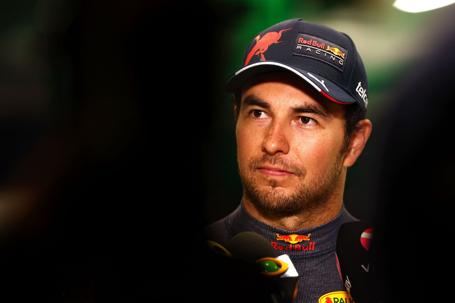 Pole position qualifier Sergio Perez of Mexico and Oracle Red Bull Racing talks to the media in the Paddock after qualifying ahead of the F1 Grand Prix of Saudi Arabia at the Jeddah Corniche Circuit on March 26, 2022 in Jeddah, Saudi Arabia. (Photo by Lars Baron/Getty Images)