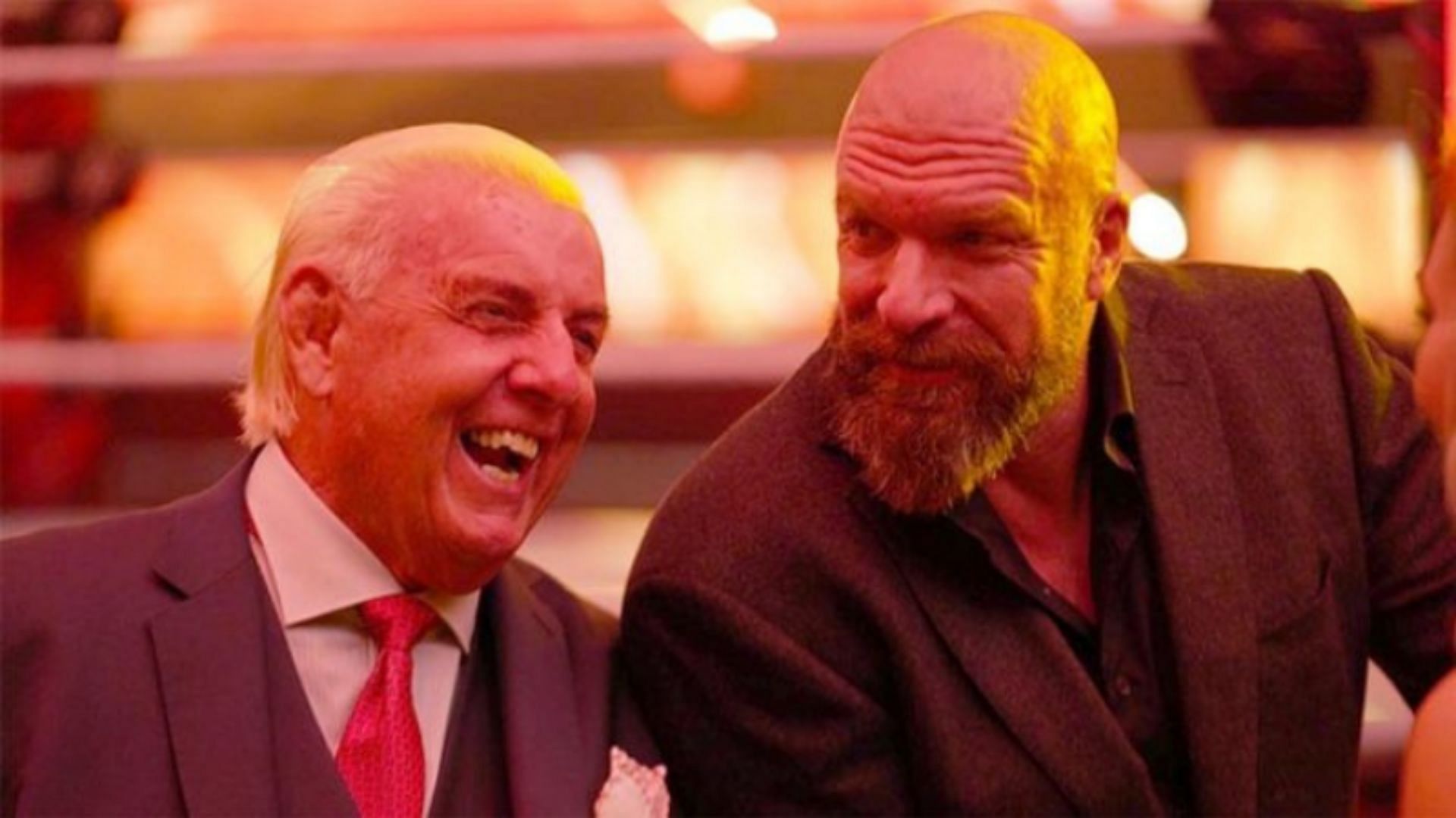Ric Flair (left); Triple H (right)