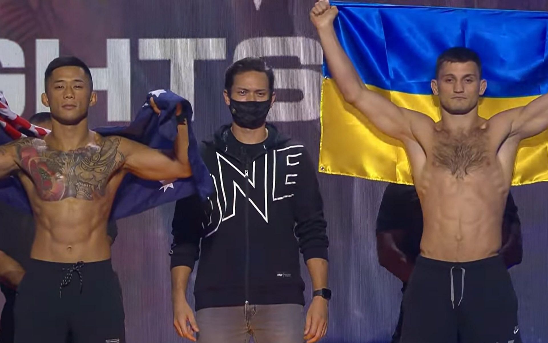 Kirill Gorobets (Right) raises Ukraine&#039;s flag as he goes up against Martin Nguyen (Left) at ONE: Lights Out. | [Photo: ONE Championship]