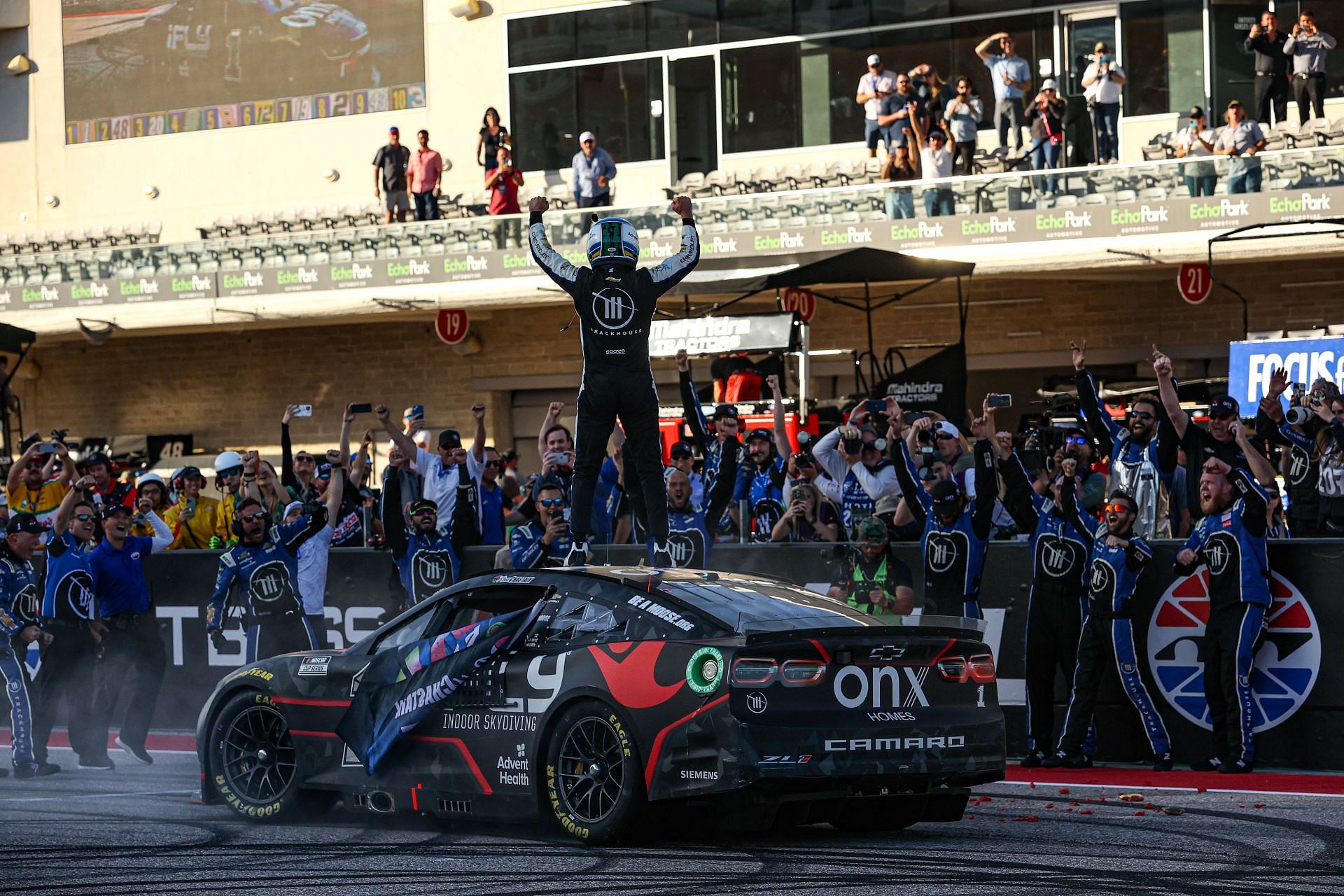 Ross Chastain celebrates after winning the NASCAR Cup Series Echopark Automotive Grand Prix at Circuit of The Americas.