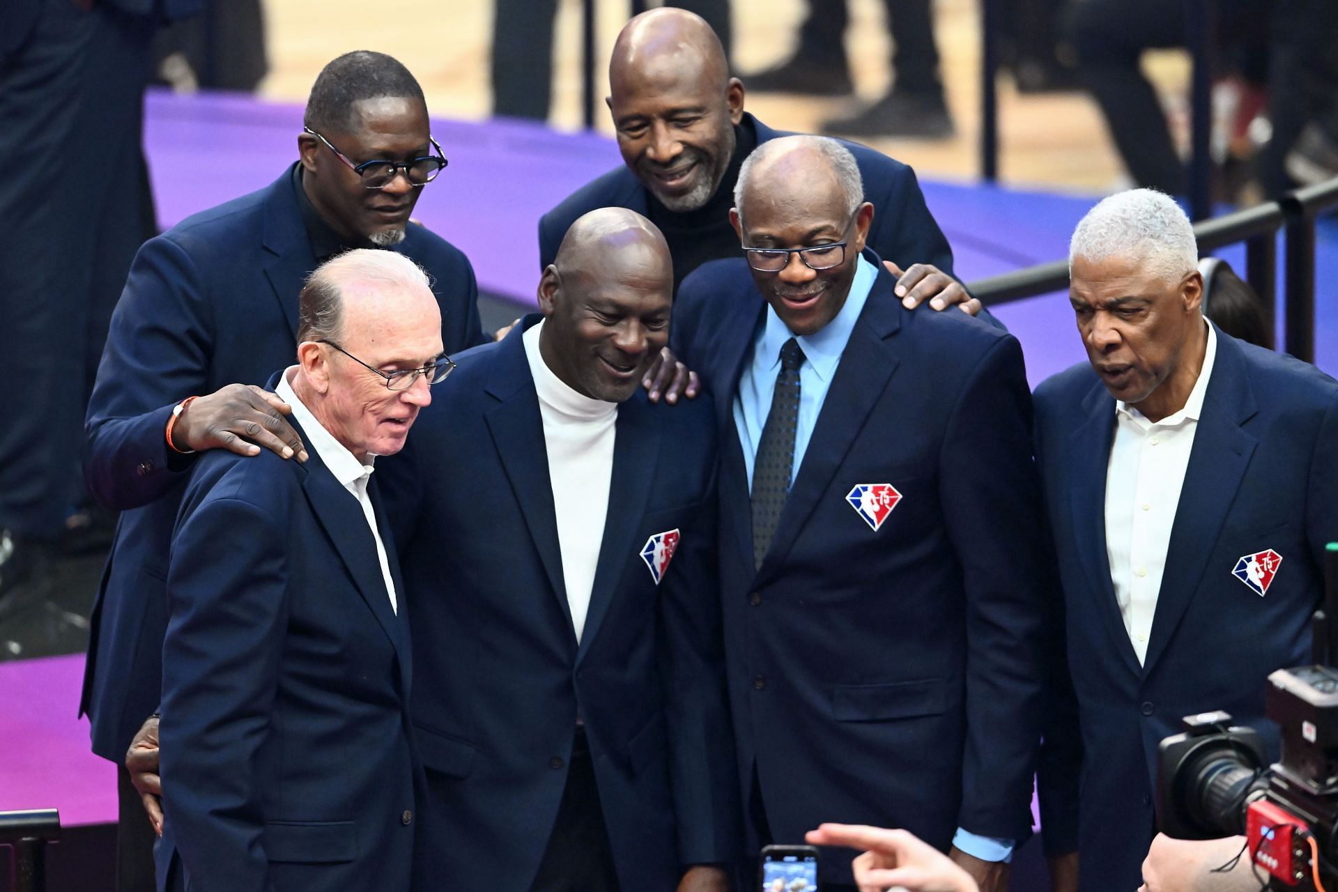 Dominique Wilkins, Michael Jordan, James Worthy, and Bob McAdoo pose for pictures after the introduction of the NBA 75th Anniversary Team
