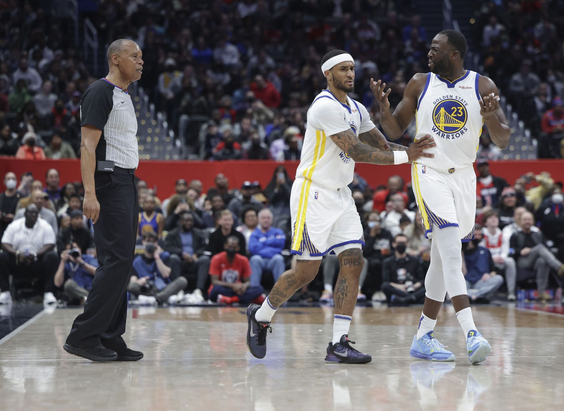 Draymond Green and Gary Payton II of the Golden State Warriors against the Washington Wizards