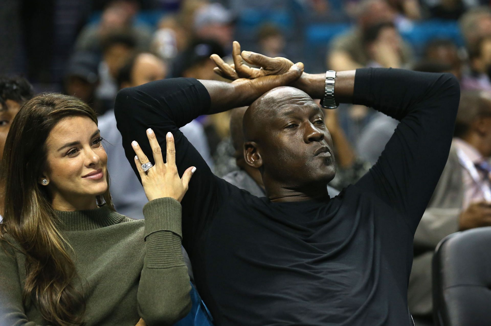 Michael Jordan watching his Charlotte Hornets