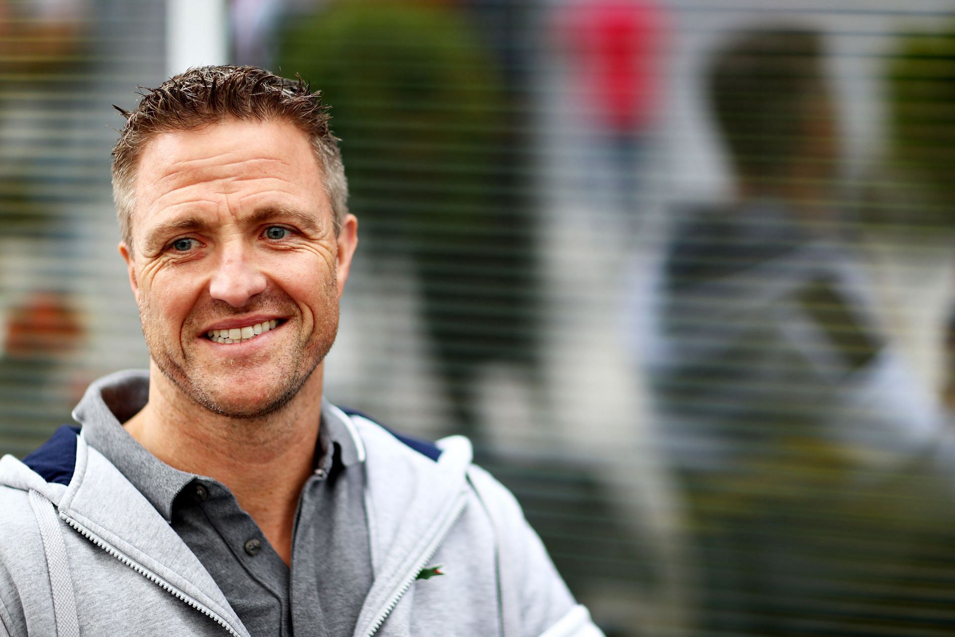 Former F1 driver Ralf Schumacher looks on in the Paddock during previews ahead of the F1 Grand Prix of Russia in Sochi (Photo by Mark Thompson/Getty Images)