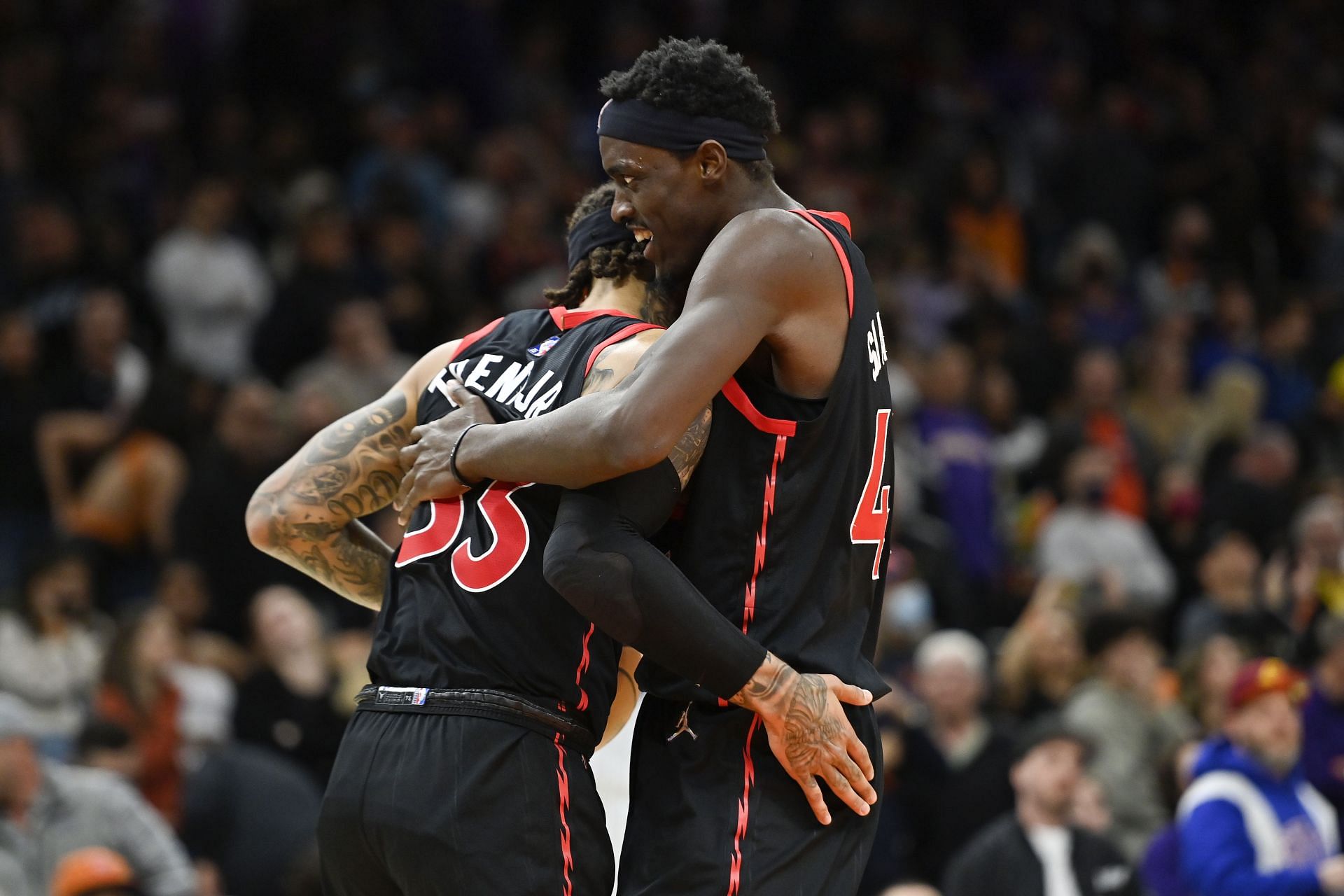Gary Trent Jr. and Pascal Siakam of the Raptors celebrate
