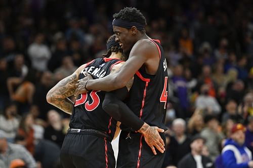 Gary Trent Jr. and Pascal Siakam of the Raptors celebrate