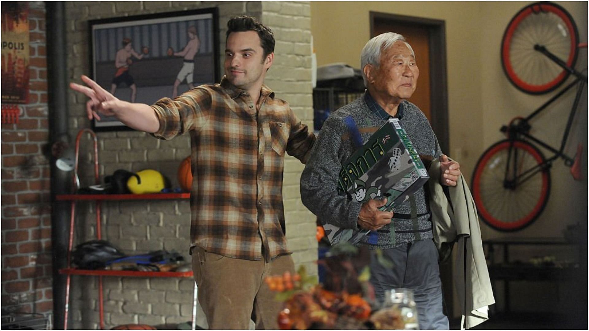 Jake Johnson and Ralph Ahn in the &ldquo;Thanksgiving IV&rdquo; episode of New Girl (Image via Fox Image Collection/Getty Images)