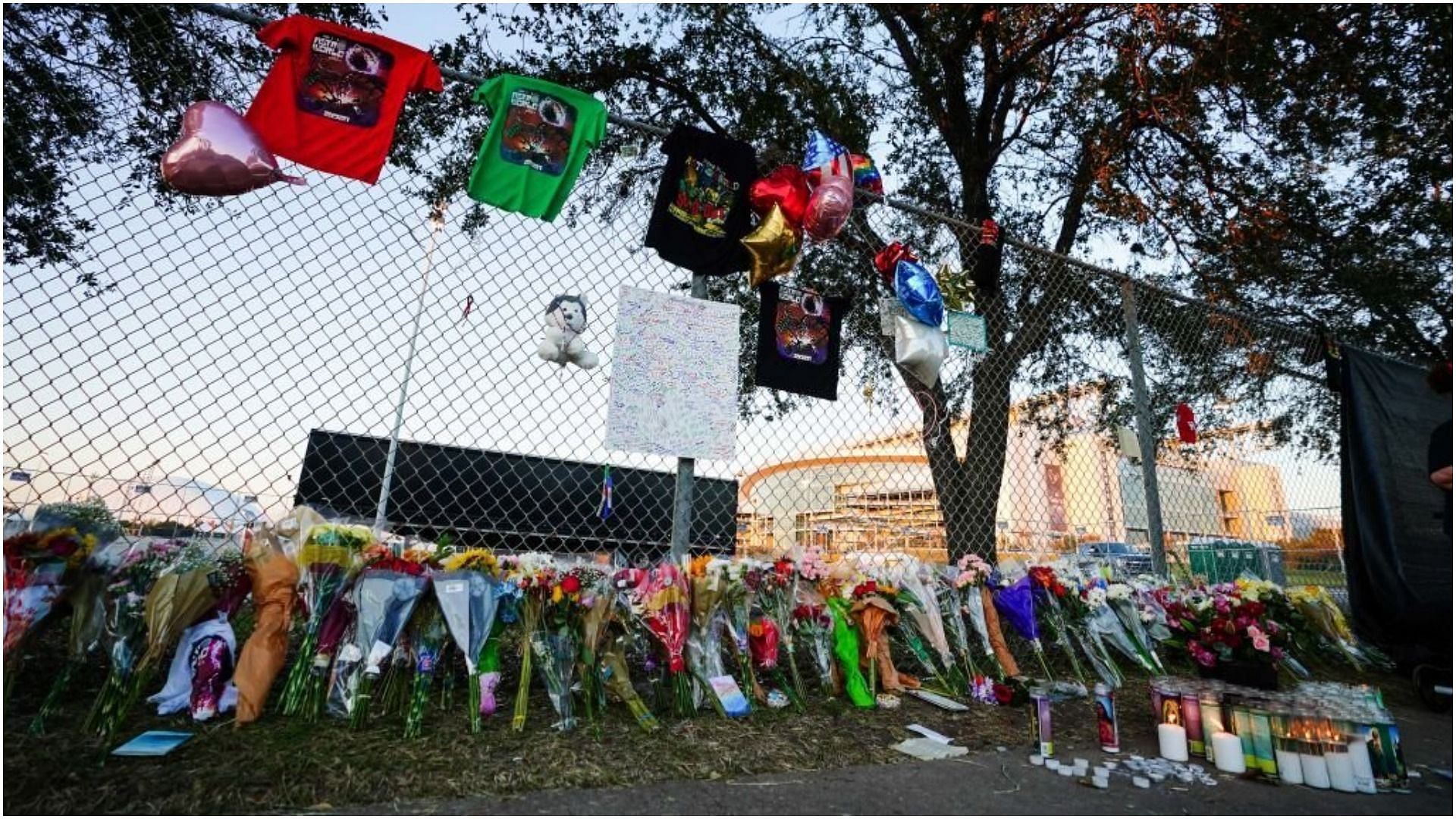 Candles, flowers and letters are placed at a memorial outside of the canceled Astroworld festival at NRG Park (Image via Alex Bierens de Haan/Getty Images)