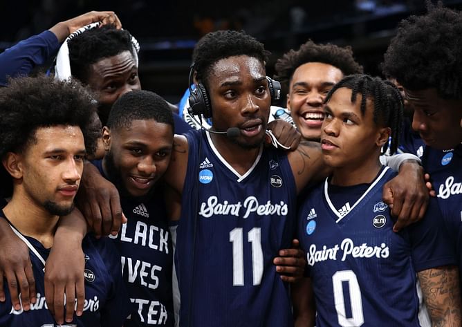Watch: "What they gon' say now?!" - Saint Peter's coach Shaheen Holloway mobbed by his players in celebration, as they eliminate Jaden Ivey's Purdue in March Madness