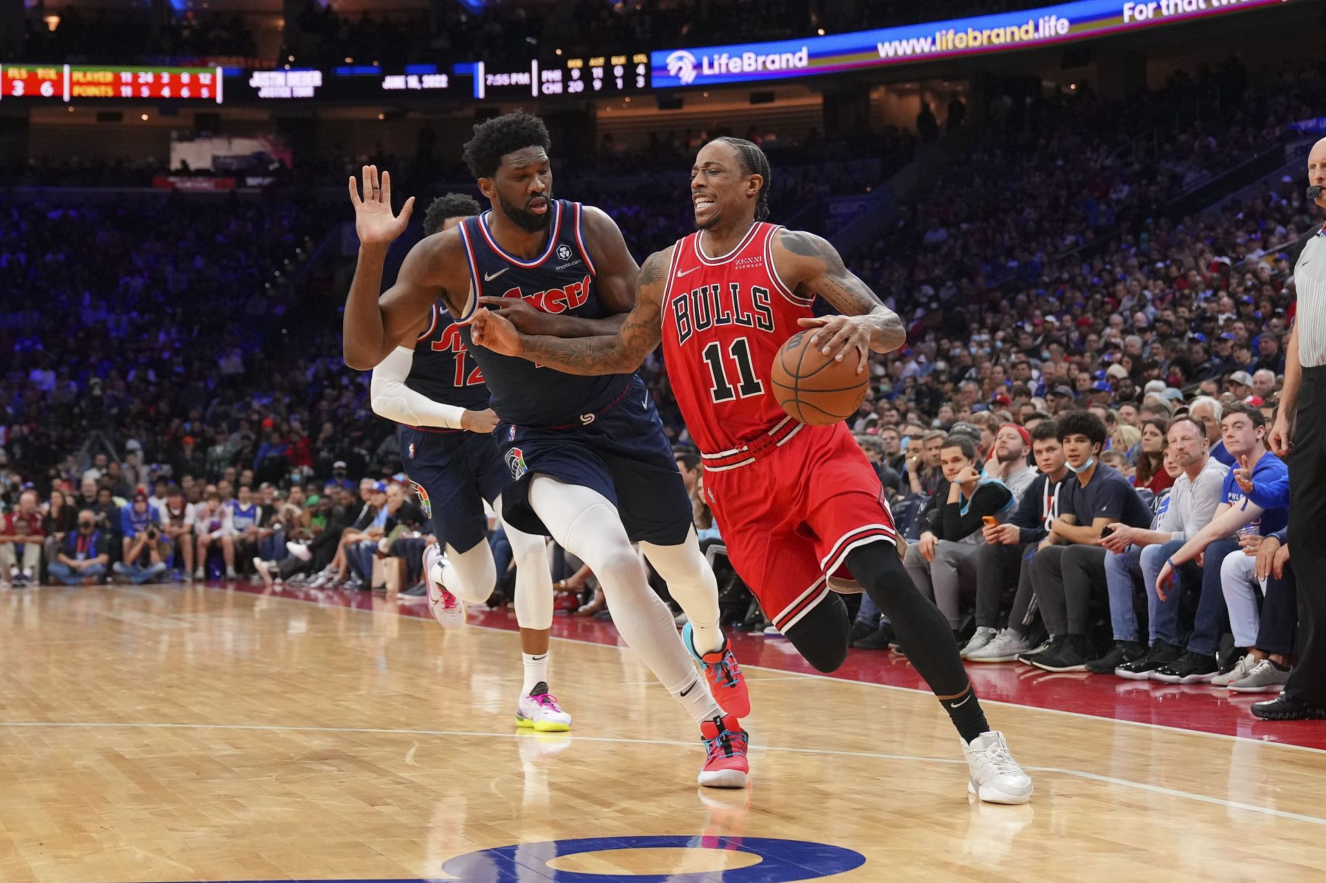 DeMar DeRozan #11 of the Chicago Bulls dribbles the ball to the basket against Joel Embiid #21 of the Philadelphia 76ers