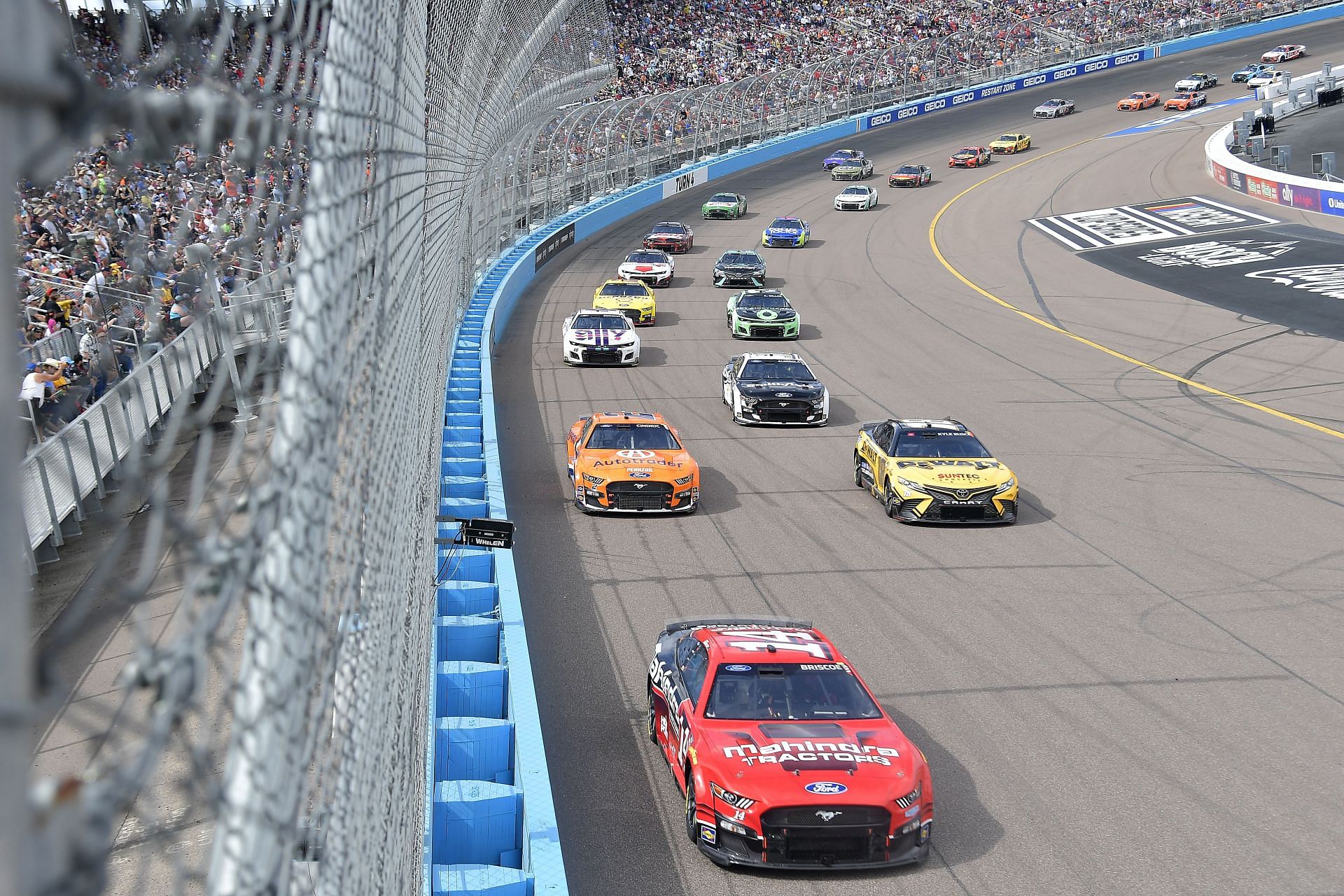 Chase Briscoe in the #14 Mahindra Tractors Ford, leads the field before going on to take victory during the Ruoff Mortgage 500 at Phoenix Raceway (Photo by Logan Riely/Getty Images)