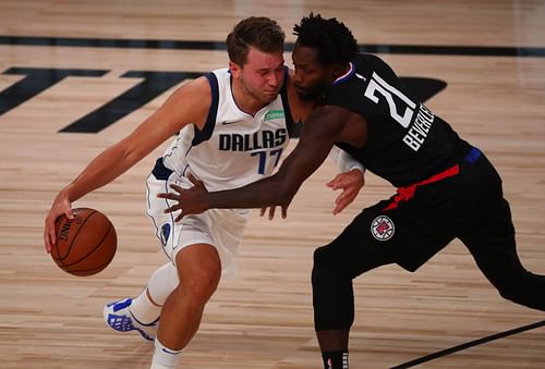 Luka Doncic and Pat Beverley had another testy encounter in the Dallas Mavericks' closely-fought win over the Minnesota Timberwolves. [Photo: The Denver Post]