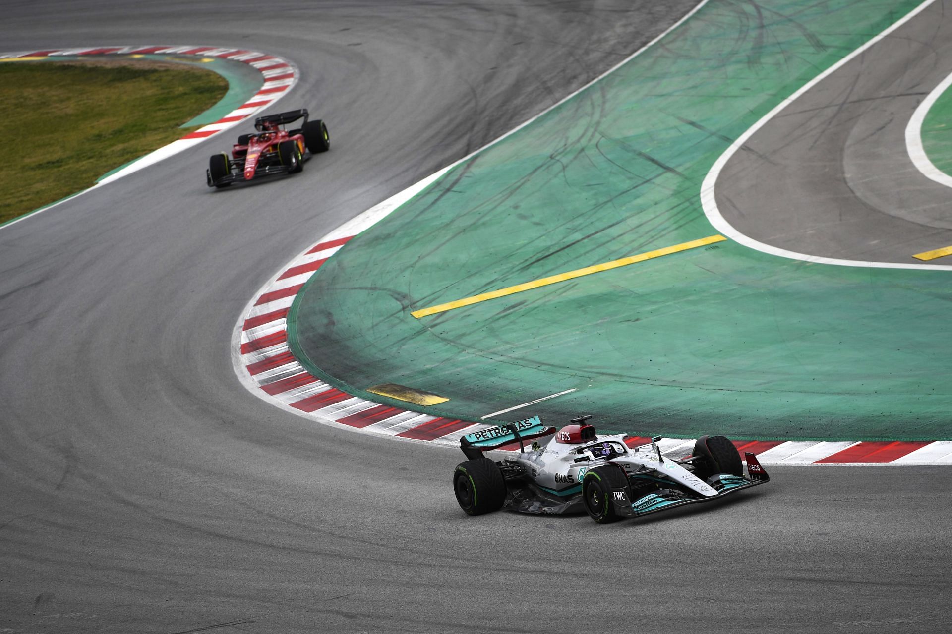 Lewis Hamilton (#44) Mercedes W13, followed by Carlos Sainz (#55) Ferrari F1-75, during the 2022 F1 pre-season test in Barcelona