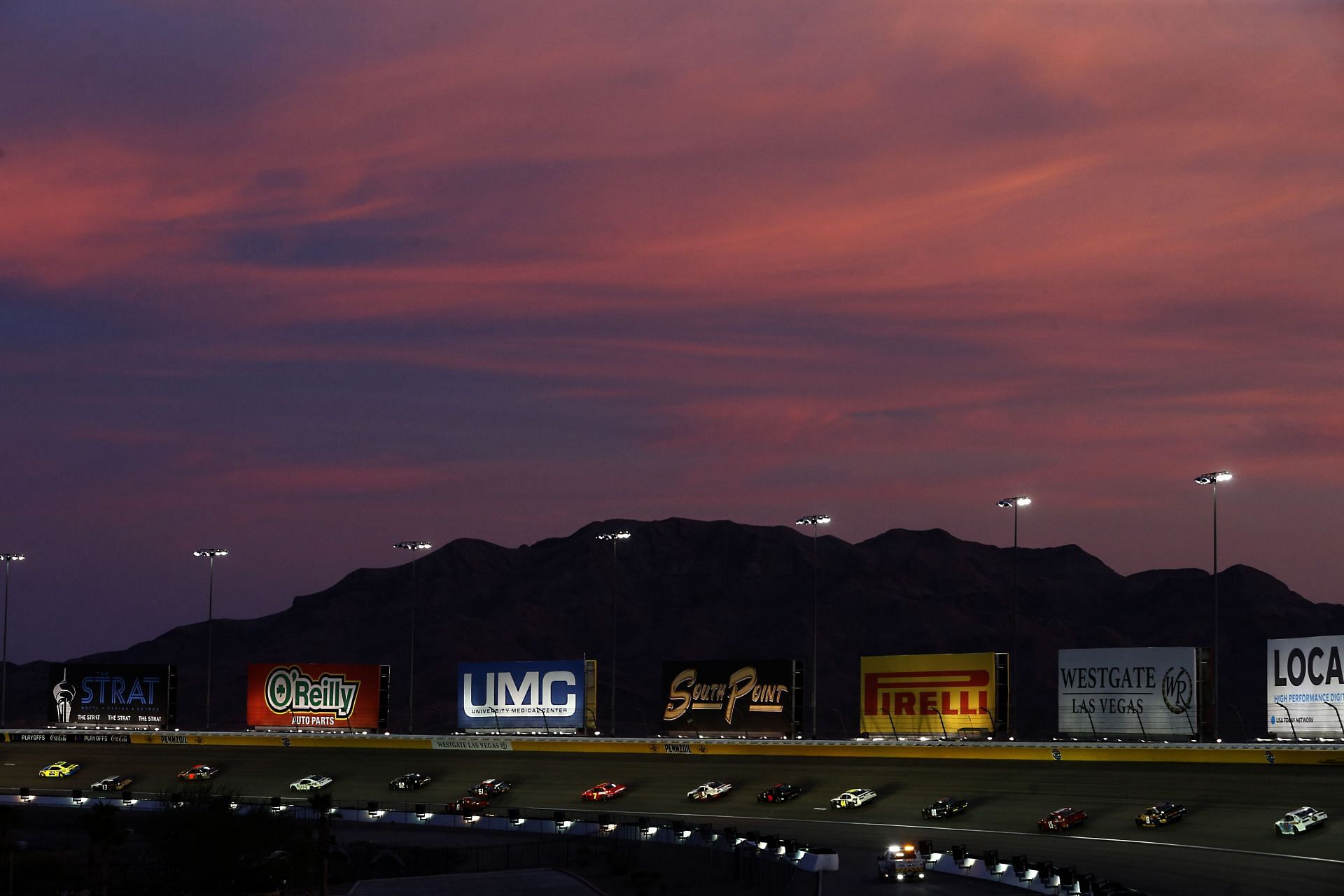 Cars race as the sun sets during the 2020 NASCAR Xfinity Series Alsco 300 at Las Vegas Motor Speedway (Photo by Brian Lawdermilk/Getty Images)