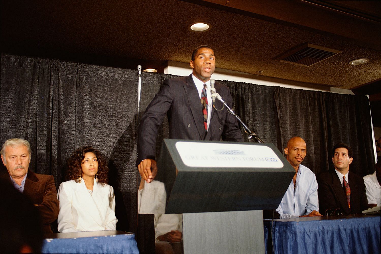 Magic Johnson shocked and shook the basketball world when he announced his retirment in 1991 due to the HIV. [Photo: Rolling Stone]