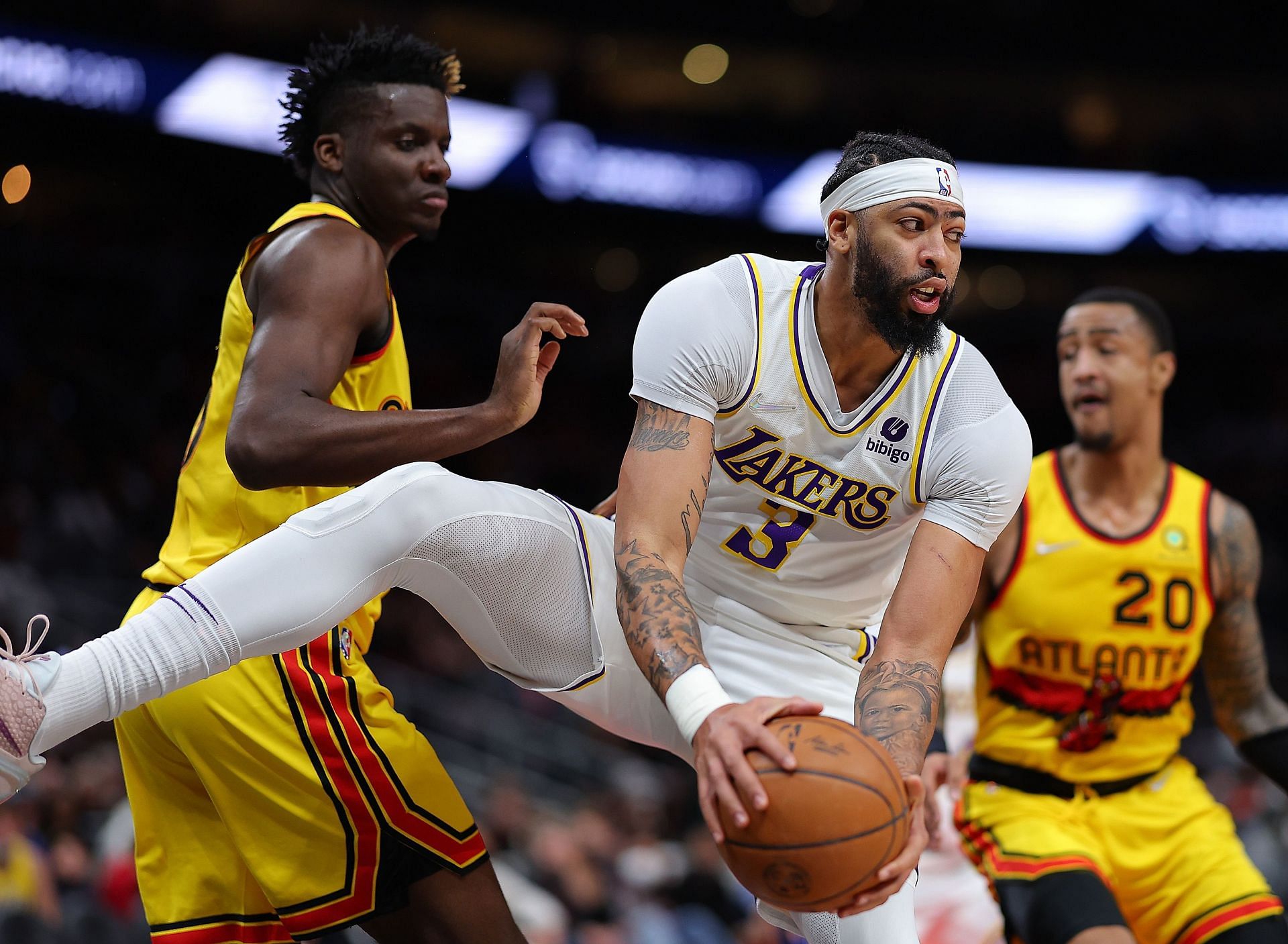 Anthony Davis #3 of the Los Angeles Lakers grabs a rebound against Clint Capela #15 of the Atlanta Hawks