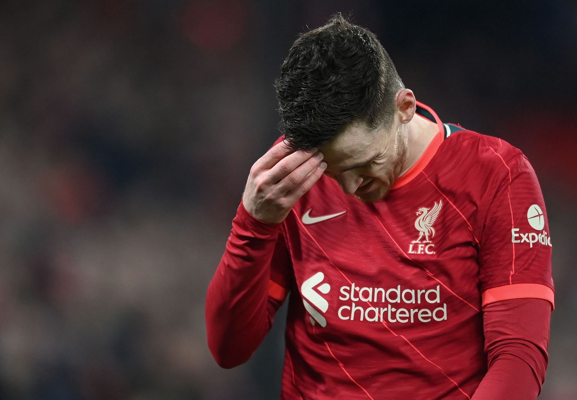 Andy Robertson dawns a dejected look.