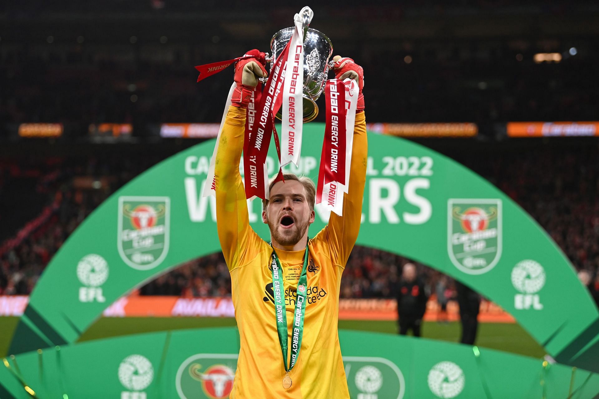 Caoimhin Kelleher lifts the EFL Cup trophy for his club