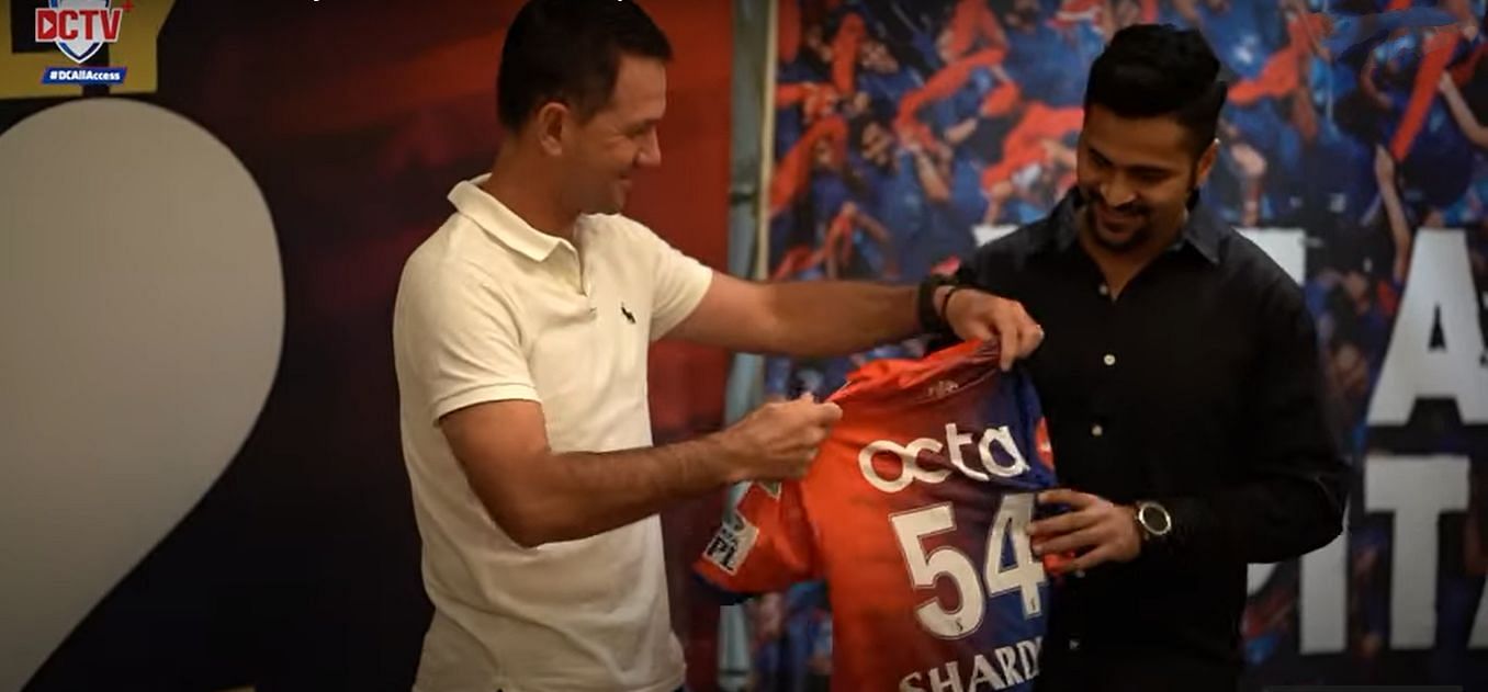 Ricky Ponting (left) presents the DC jersey to Shardul Thakur. Pic: DC/ YouTube
