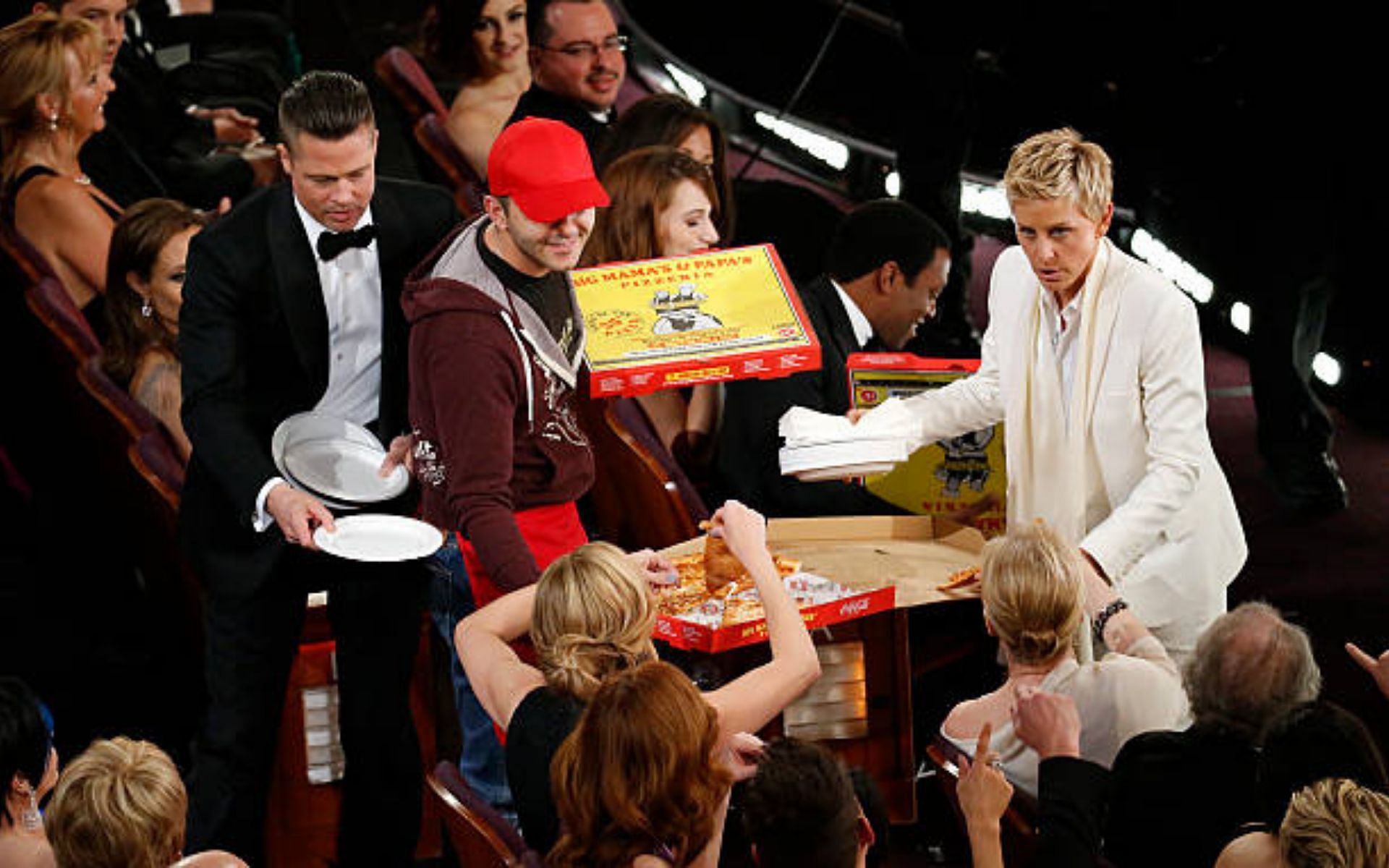 Ellen DeGeneres sharing pizza with celebrities at the 86th Annual Academy Awards (Image via Getty Images)