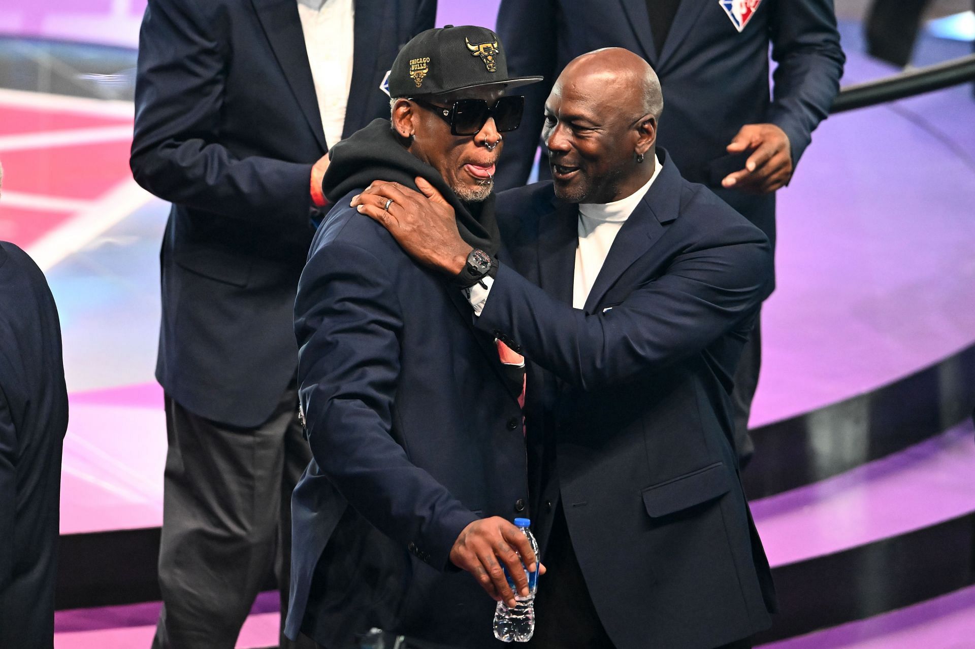 Dennis Rodman, left, and Michael Jordan pose for photos after the introduction of the NBA 75th Anniversary Team during the All-Star Game Feb. 20 in Cleveland, Ohio.