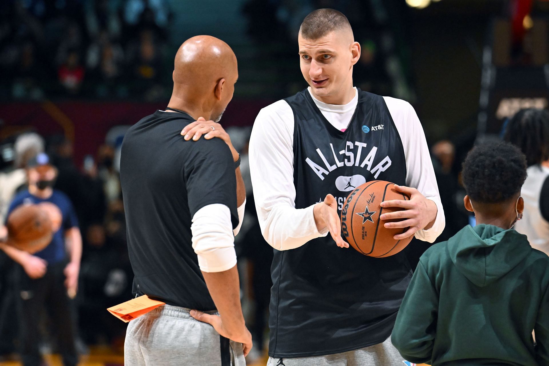 Nikola Jokic talks with head coach Monty Williams at the 2022 NBA All-Star Practice