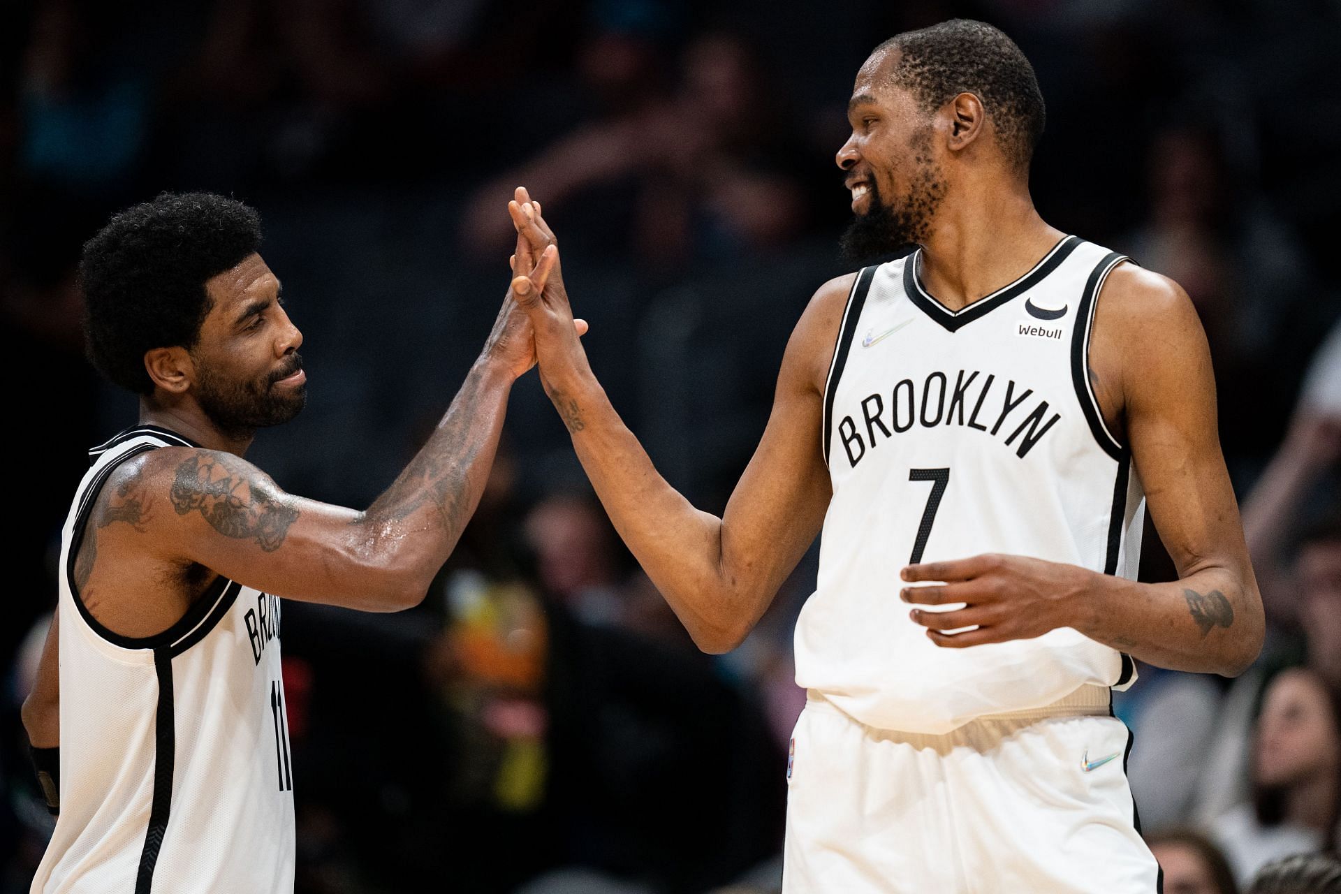 Kevin Durant (7) congratulates Kyrie Irving