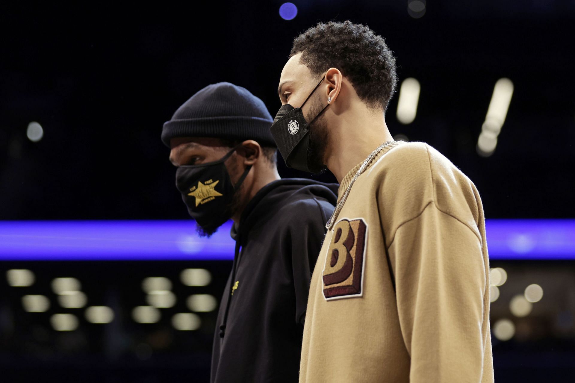 Ben Simmons in conversation with Brooklyn Nets teammate Kevin Durant