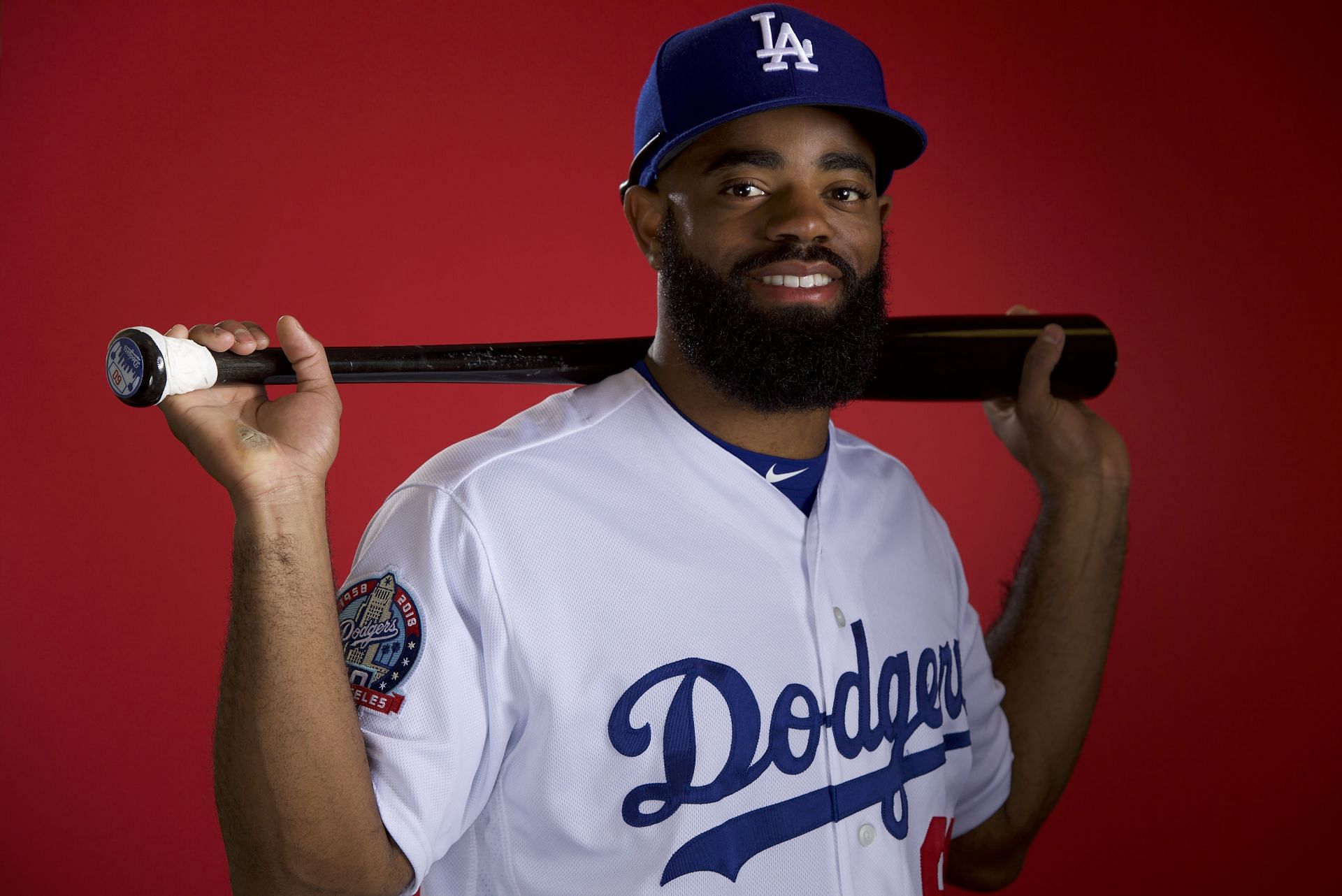 Los Angeles Dodgers Outfield Andrew Toles looks on from the dugout