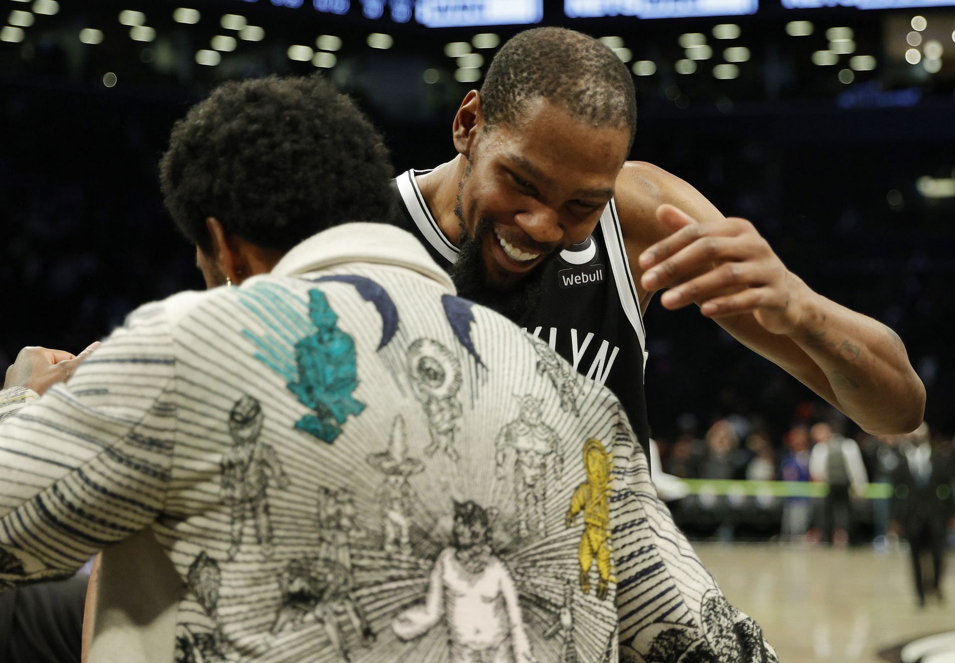 Kevin Durant #7 of the Brooklyn Nets hugs Kyrie Irving #11 after the second half against the New York Knicks