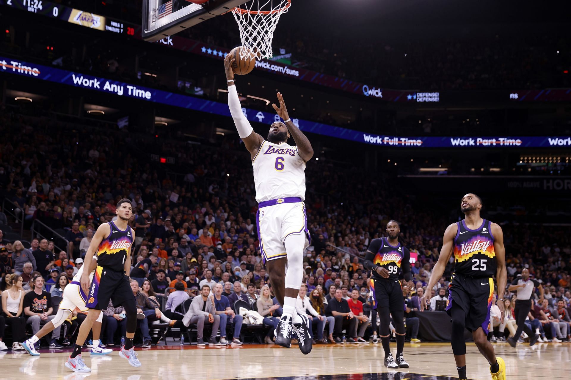 LA Lakers forward LeBron James scores against the Phoenix Suns.