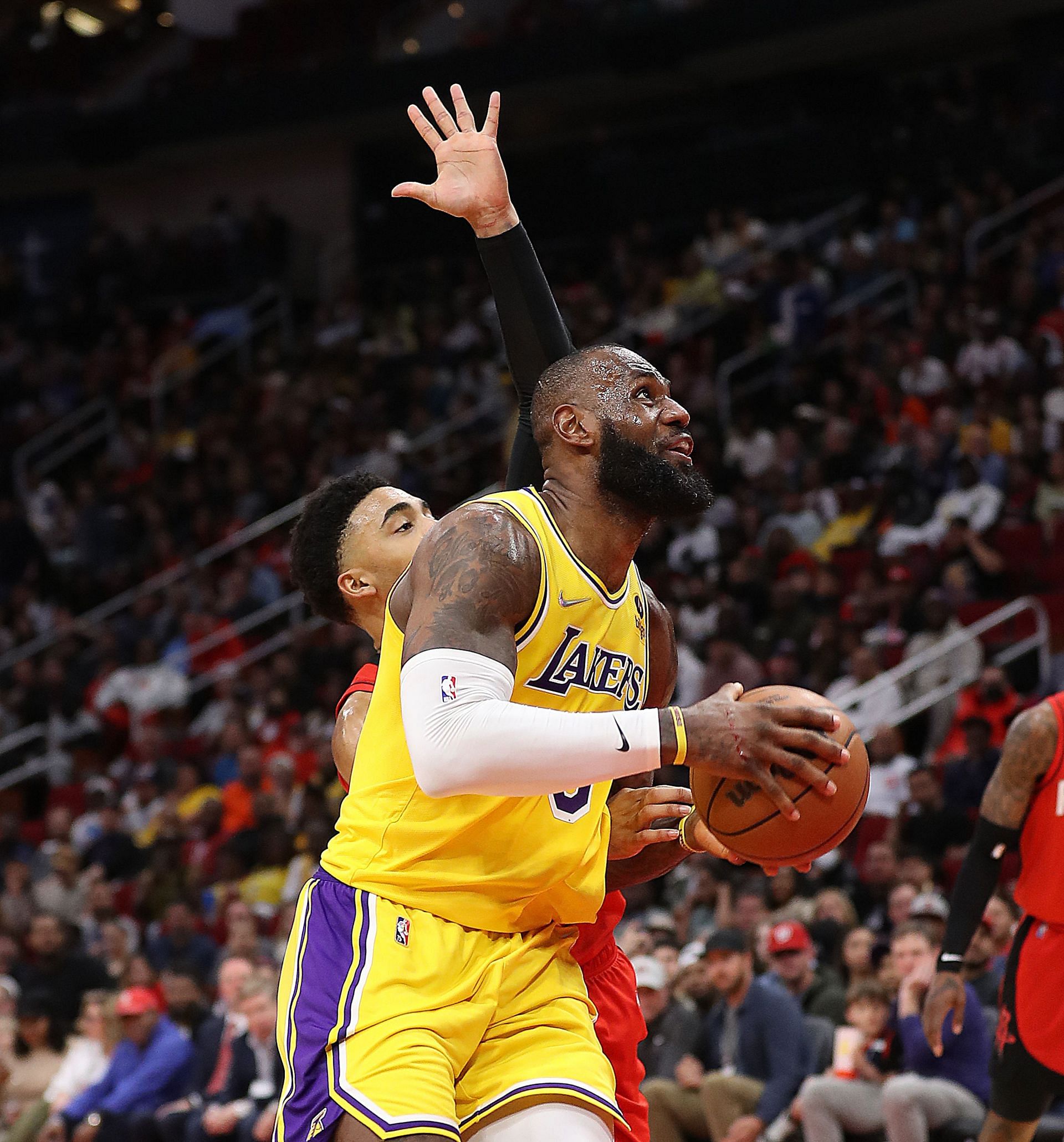 LeBron James of the LA Lakers drives to the basket against Kenyon Martin Jr. of the Houston Rockets during the fourth quarter at Toyota Center on Wednesday in Houston, Texas.