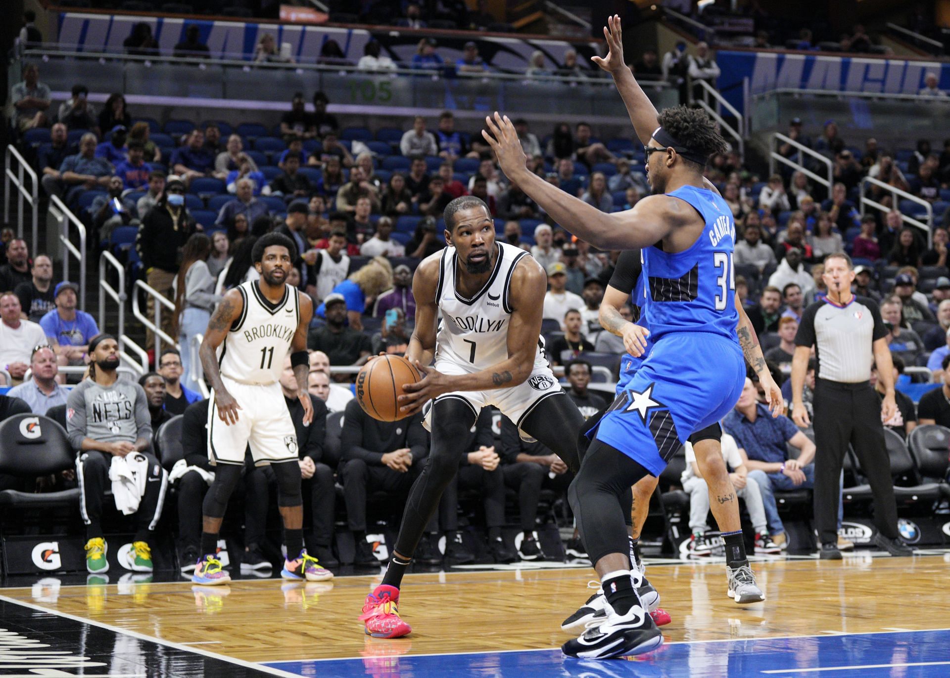 Kevin Durant of the Brooklyn Nets looks to pass against Wendell Carter Jr. of the Orlando Magic.